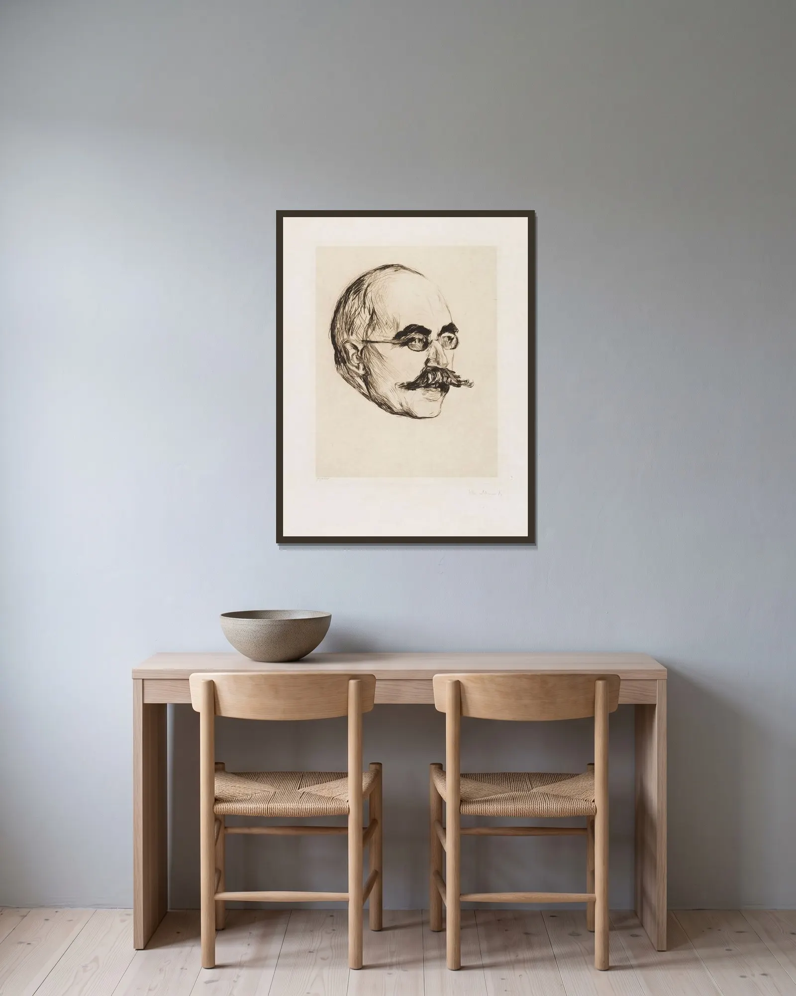 Gustav Schiefler av Edvard Munch inramad på en vägg
