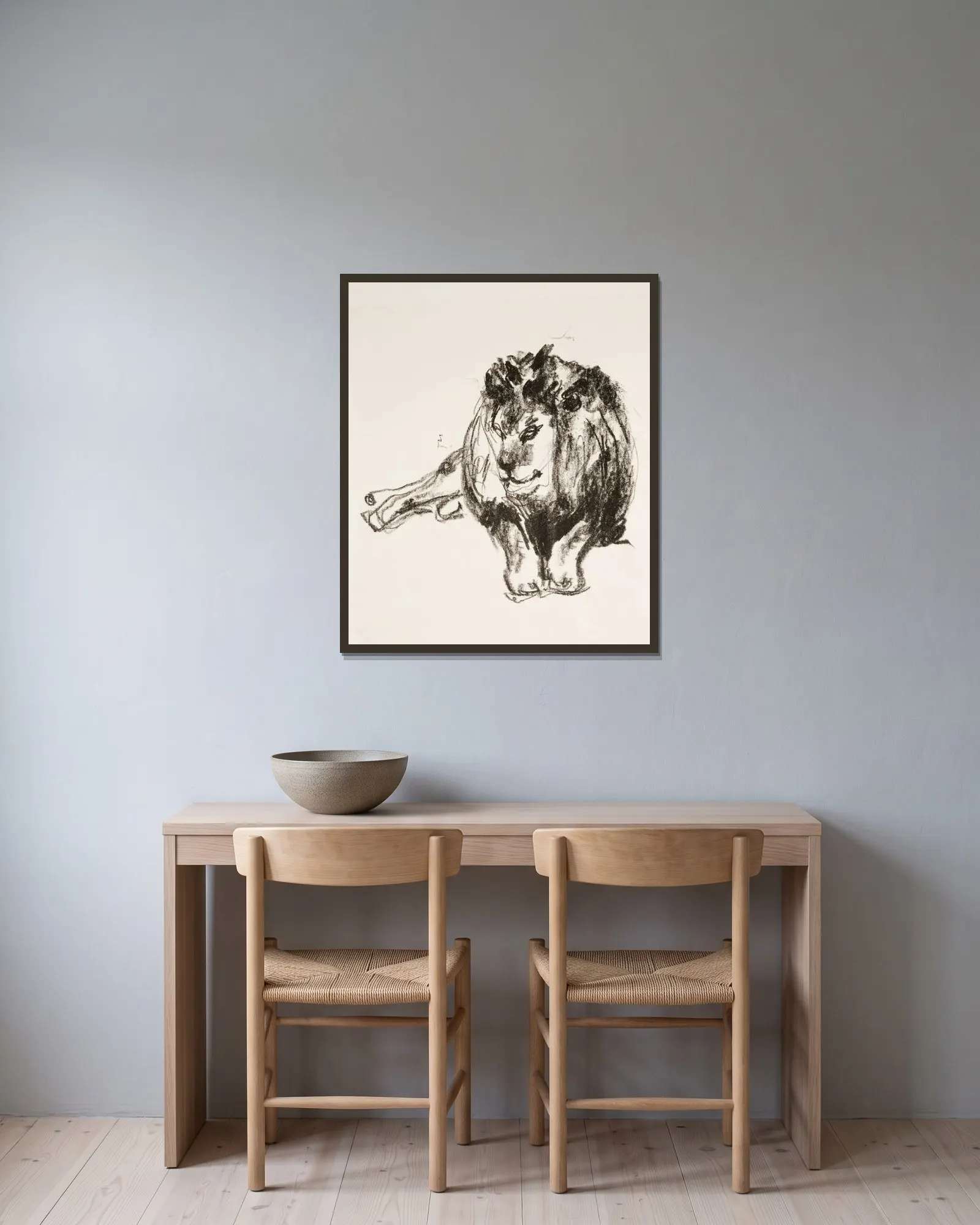 Lion Lying Down av Edvard Munch inramad på en vägg