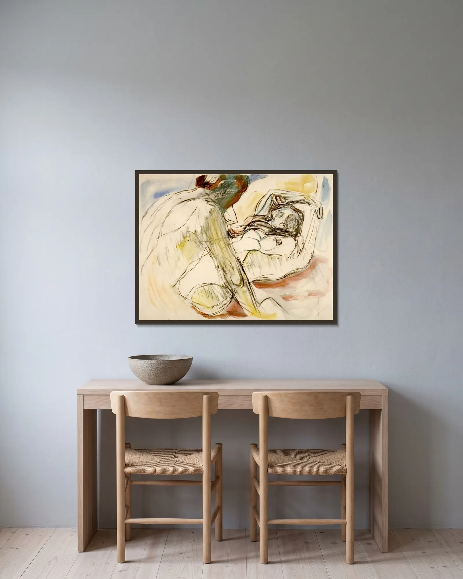 Mann og kvinne av Edvard Munch inramad på en vägg