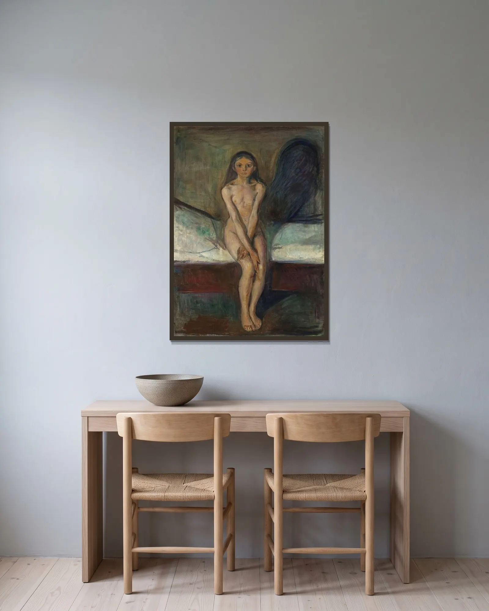 Puberty av Edvard Munch inramad på en vägg