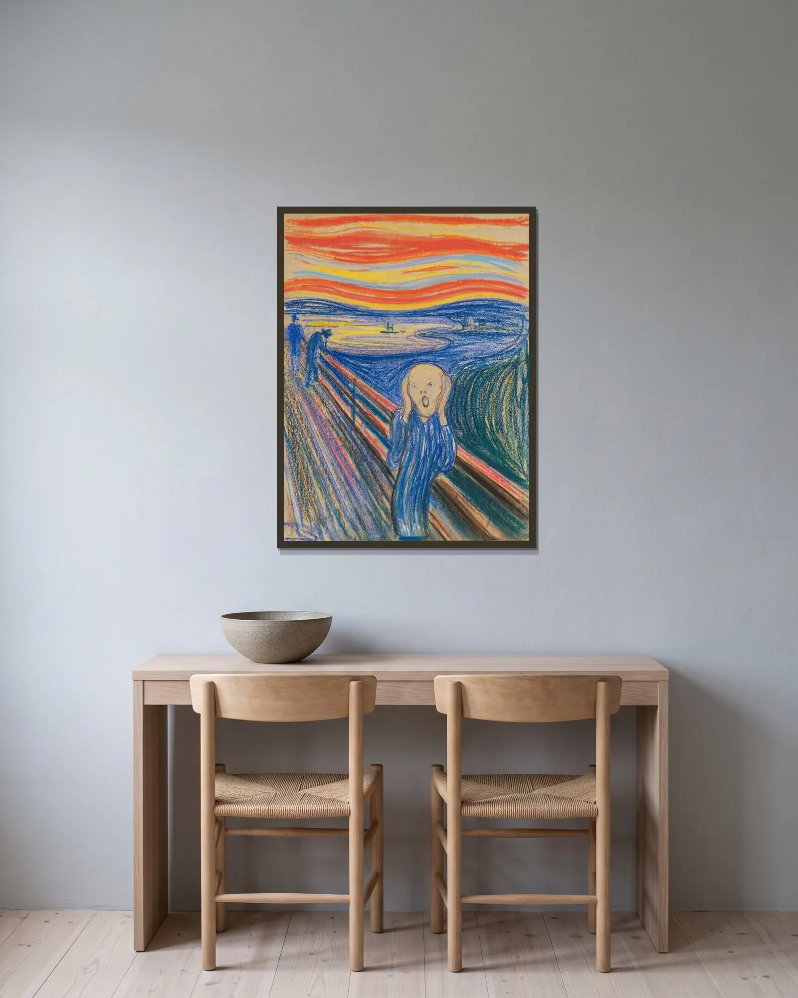 The Scream av Edvard Munch inramad på en vägg