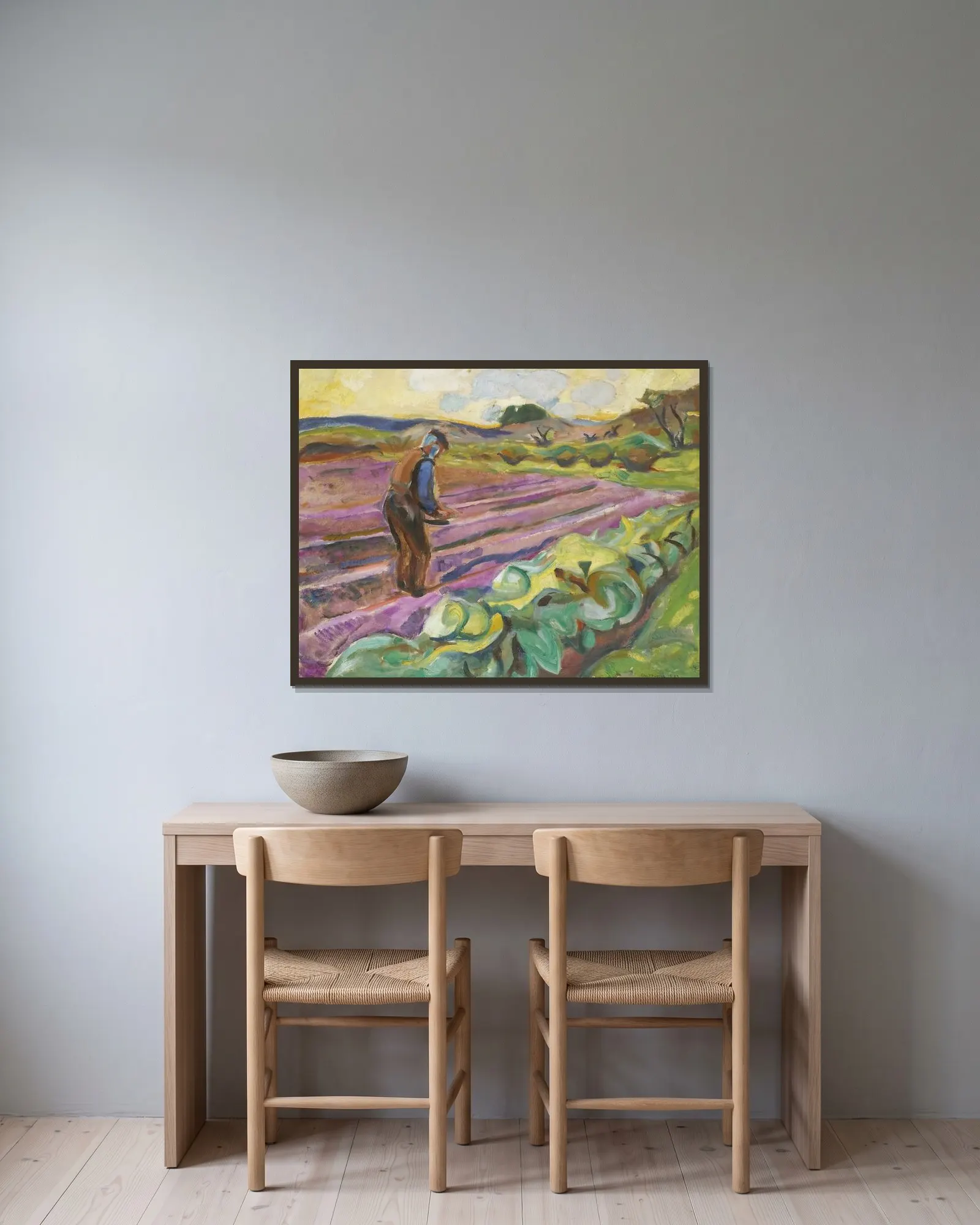 The Sower av Edvard Munch inramad på en vägg