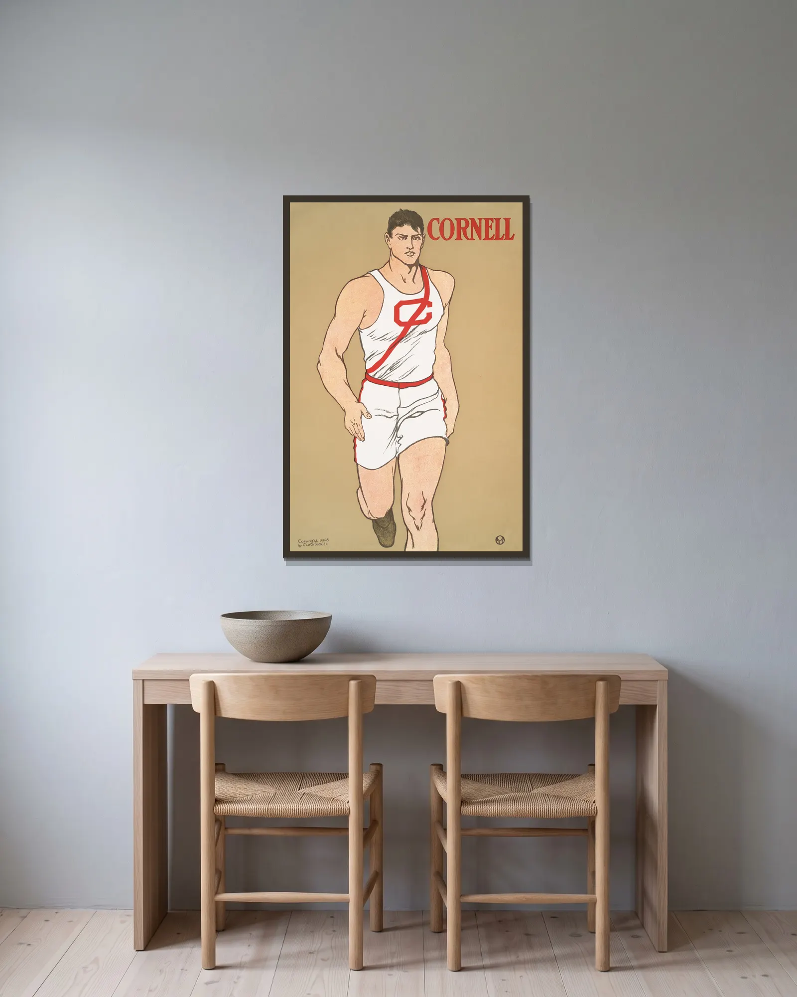 Cornell av Edward Penfield inramad på en vägg