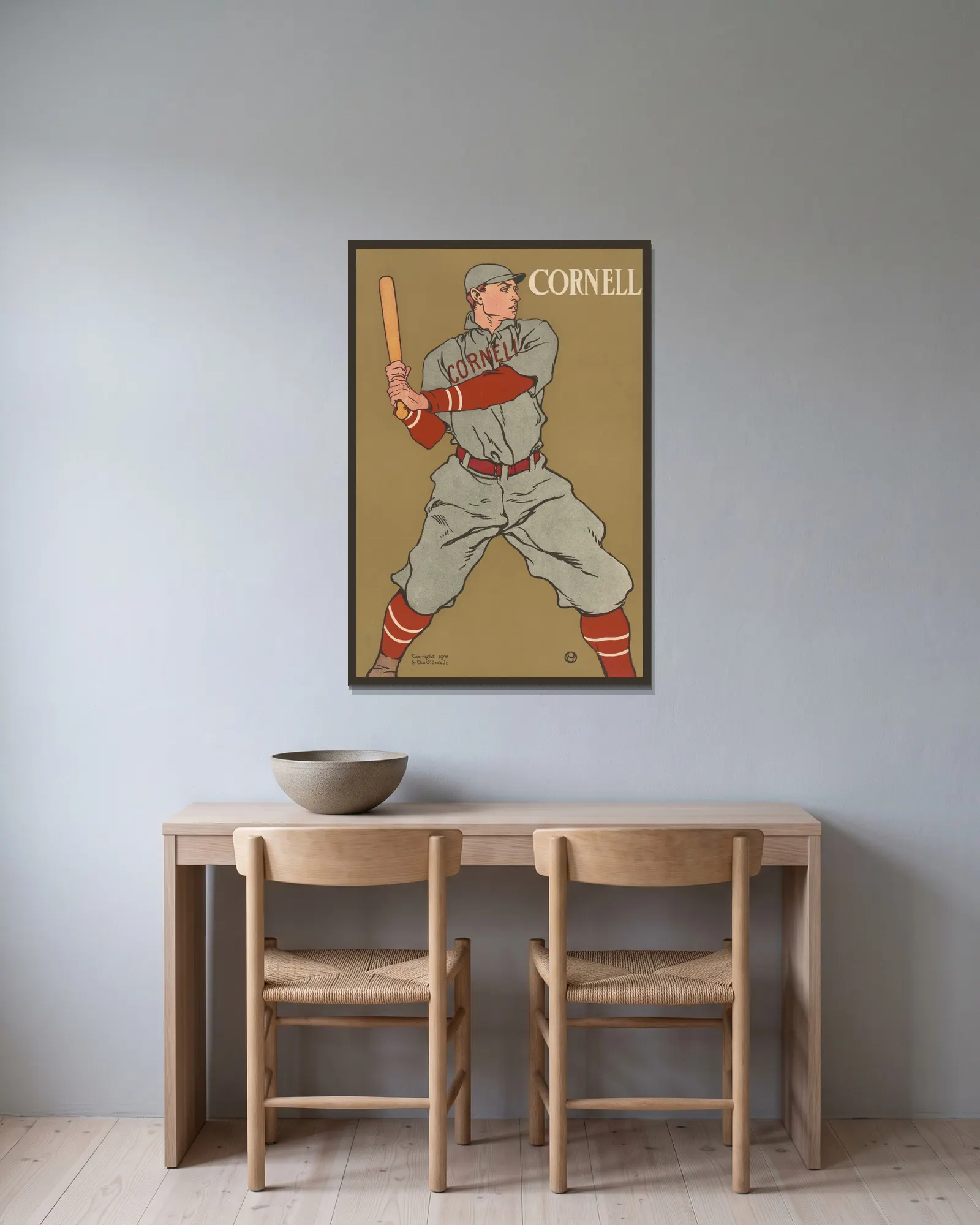 Cornell av Edward Penfield inramad på en vägg