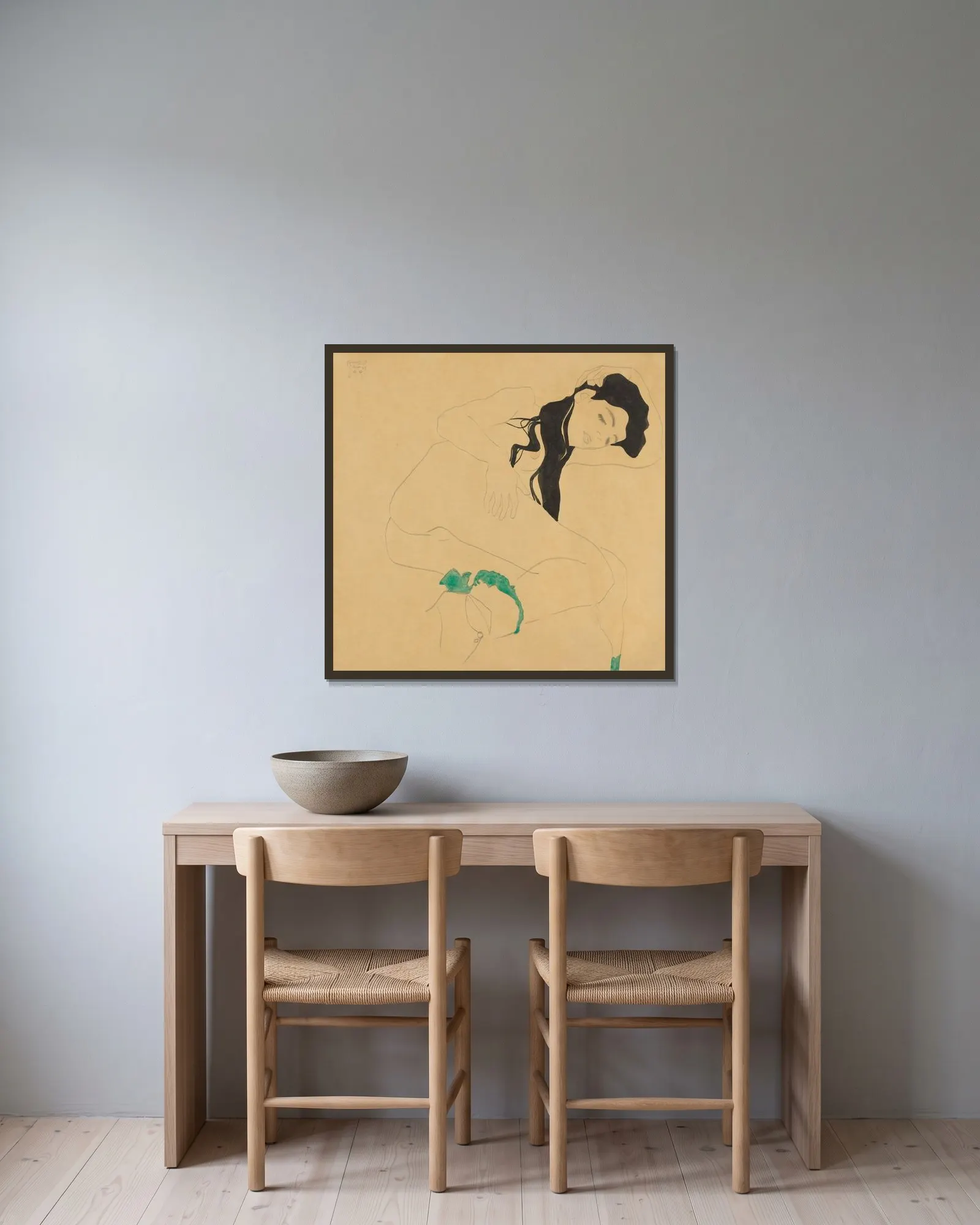 Liegender Mädchenakt av Egon Schiele inramad på en vägg