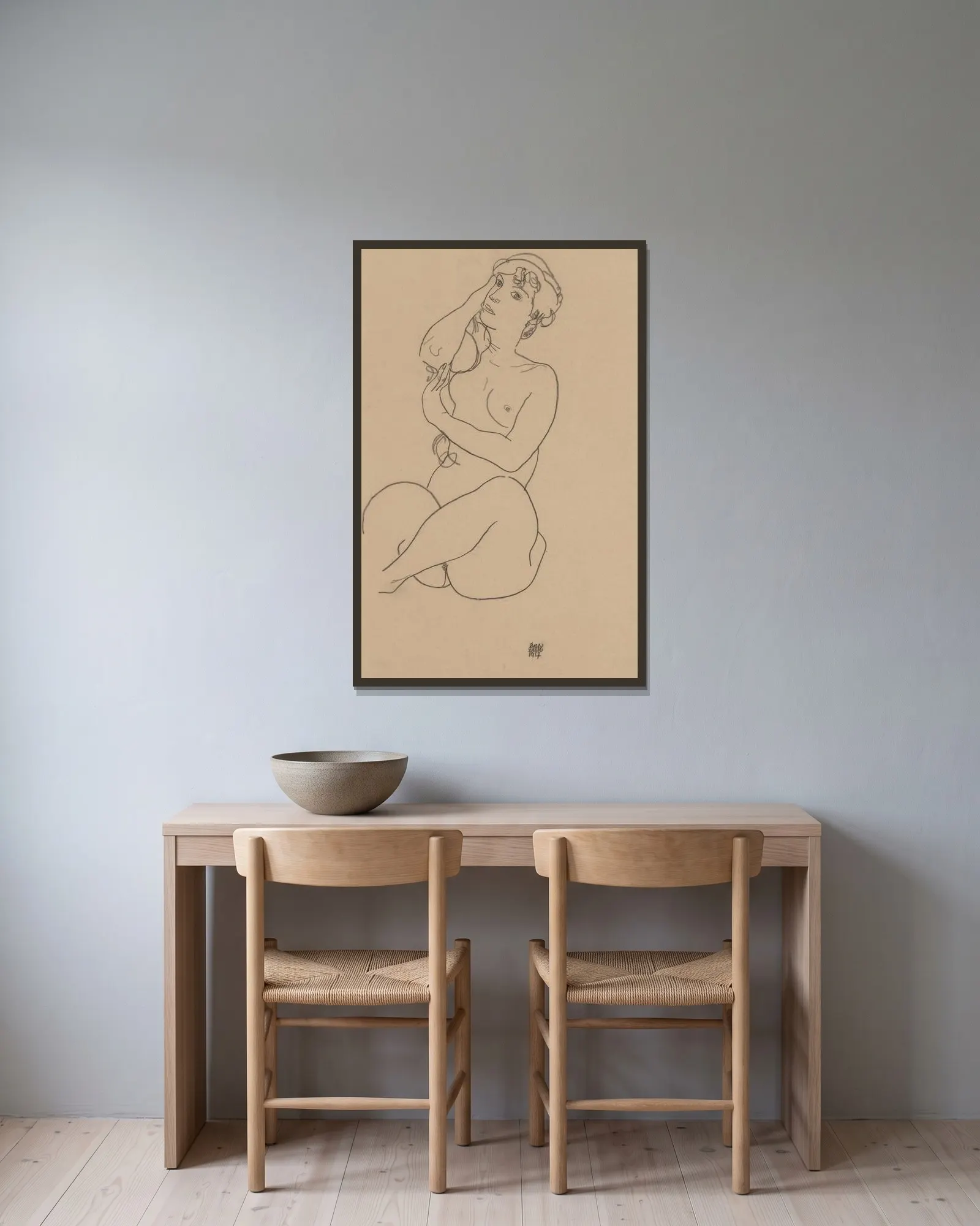 Nude av Egon Schiele inramad på en vägg