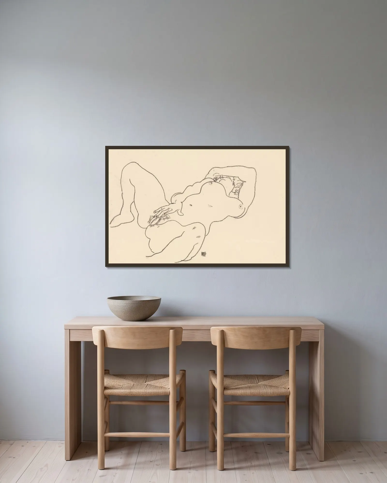 Reclining Nude av Egon Schiele inramad på en vägg