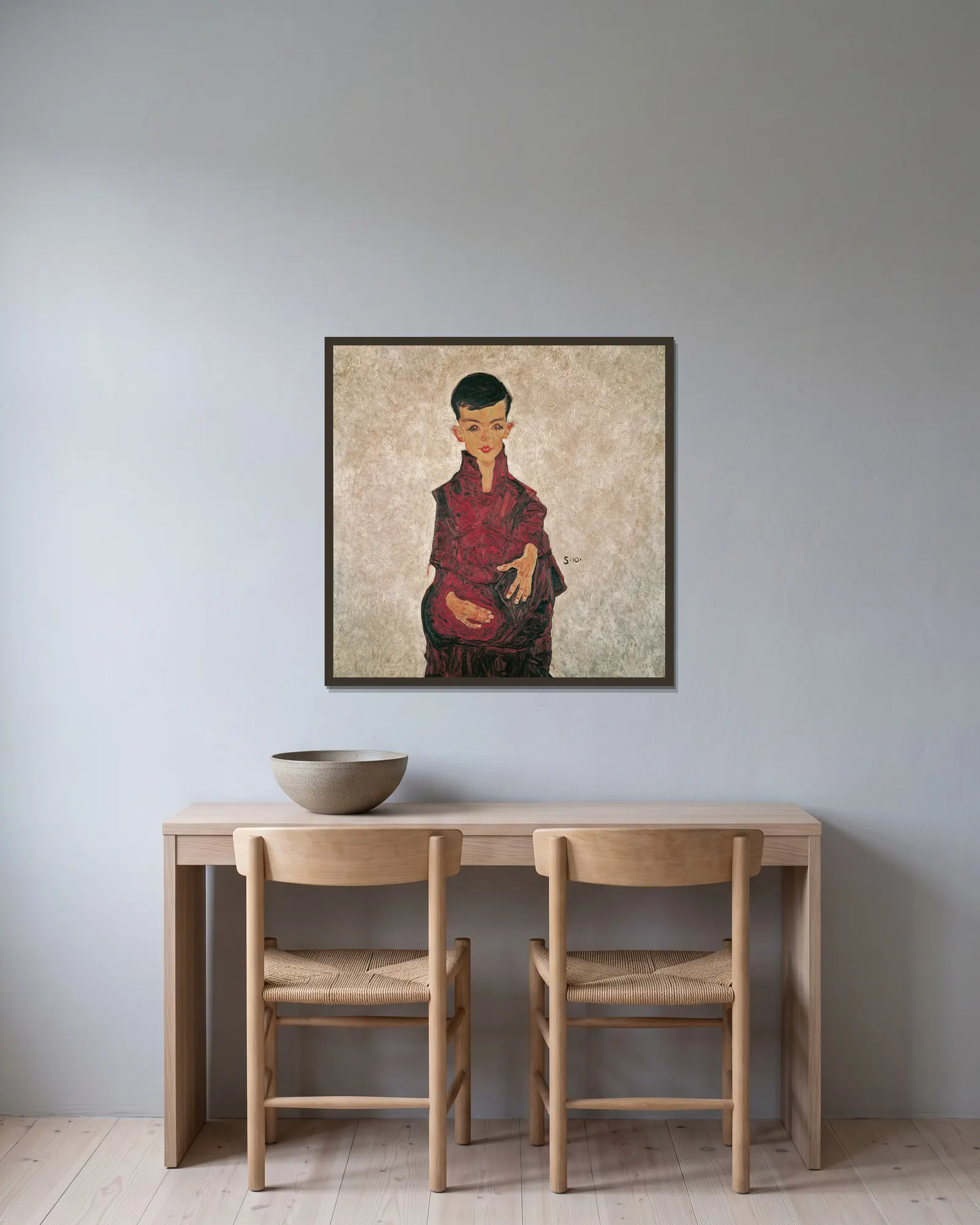 Reinerbub (Bildnis Herbert Reiner) av Egon Schiele inramad på en vägg