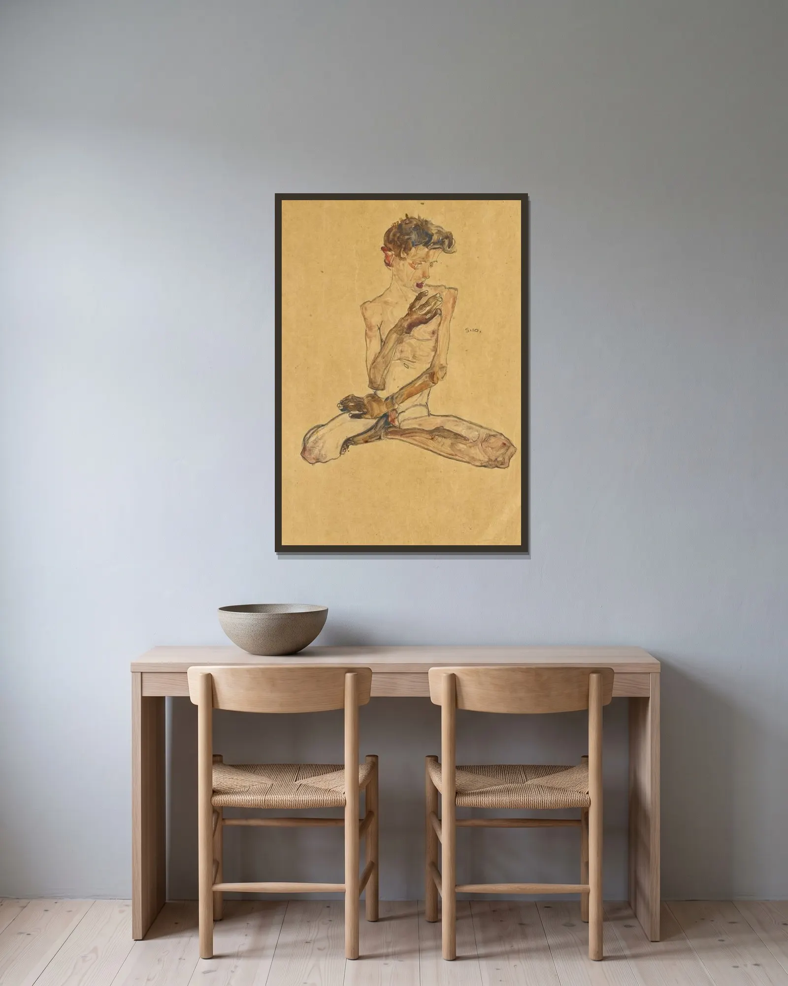 Sitzender Junge (Seated Boy) av Egon Schiele inramad på en vägg