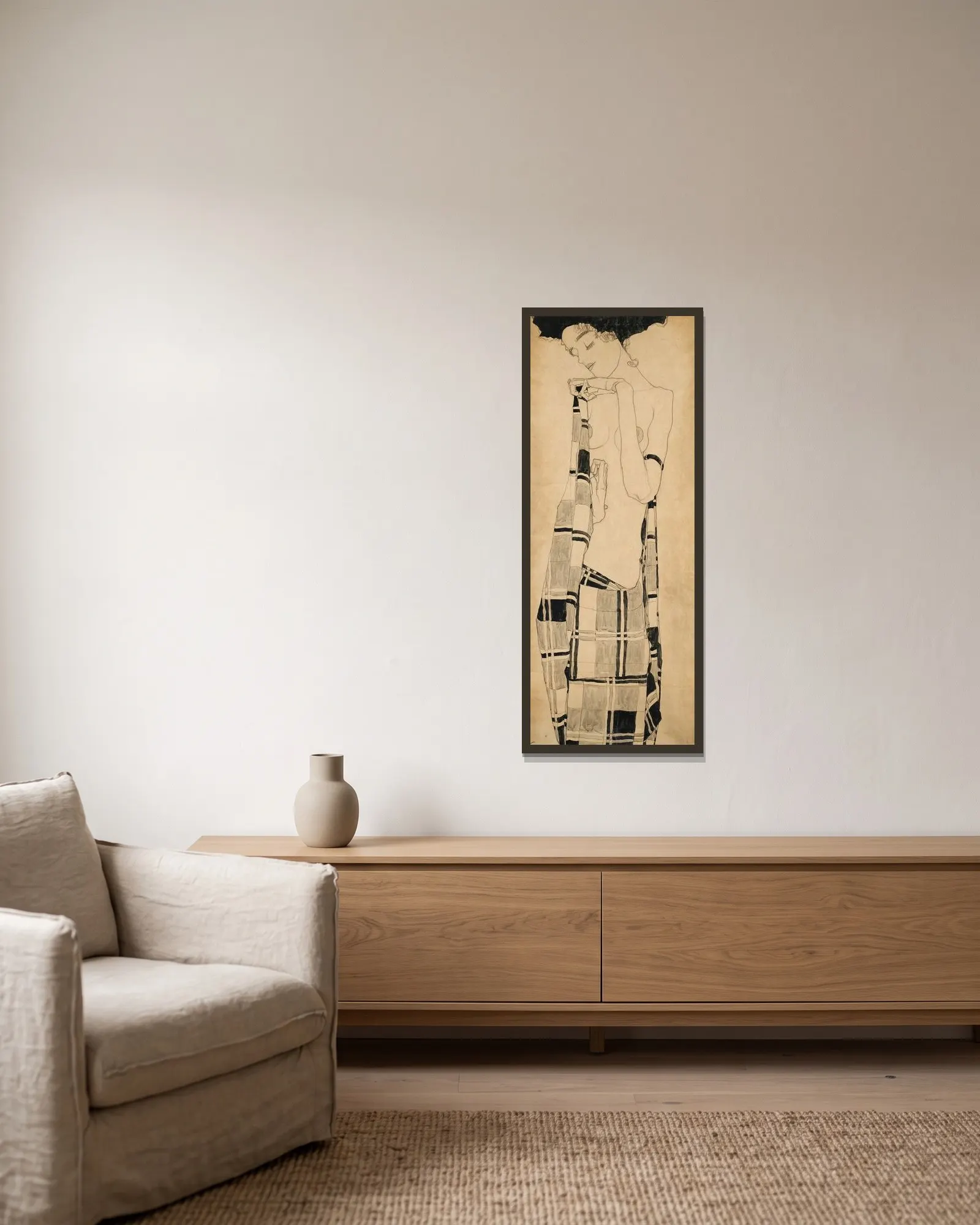 Standing Girl av Egon Schiele inramad på en vägg