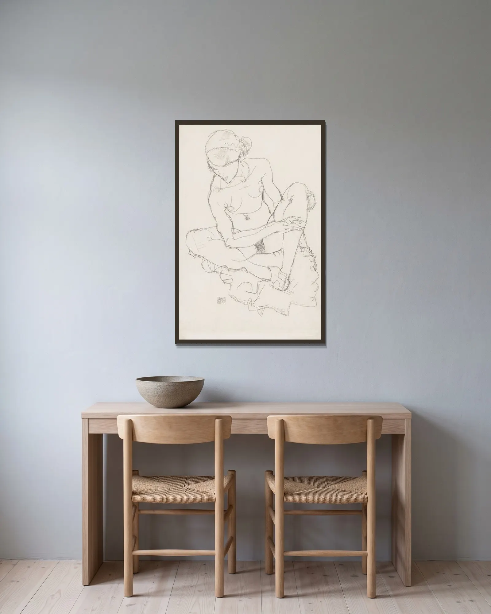Untitled av Egon Schiele inramad på en vägg