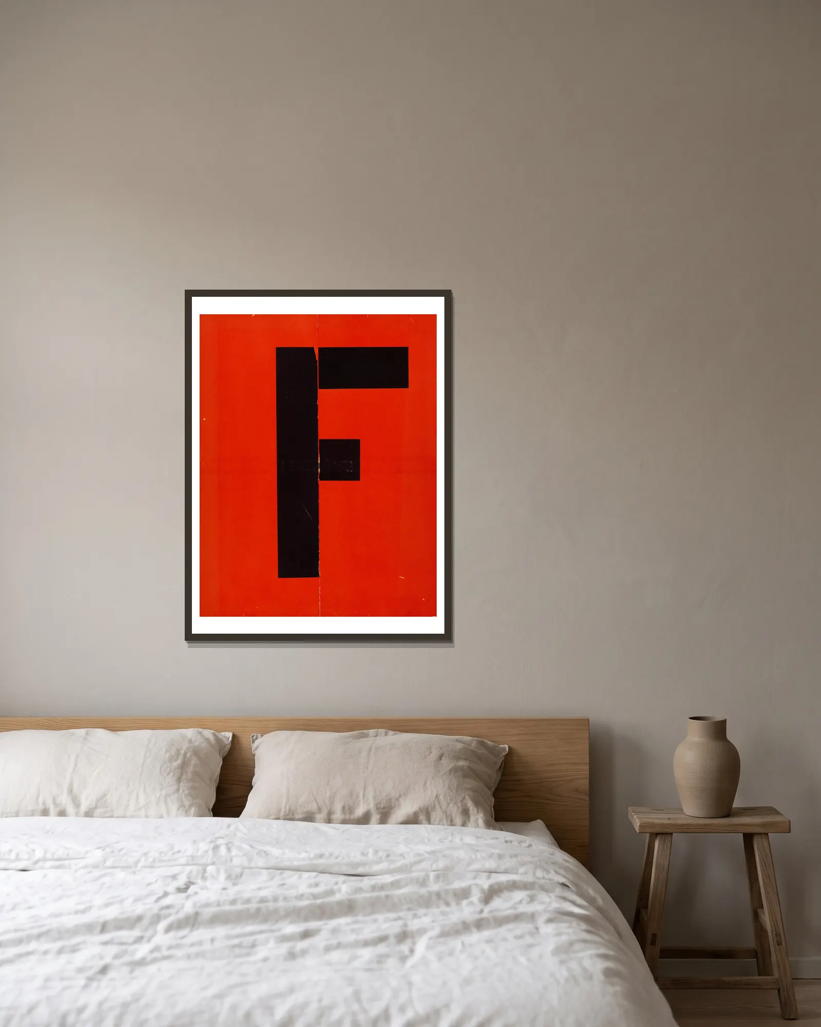 Figurines – cover av El Lissitzky inramad på en vägg