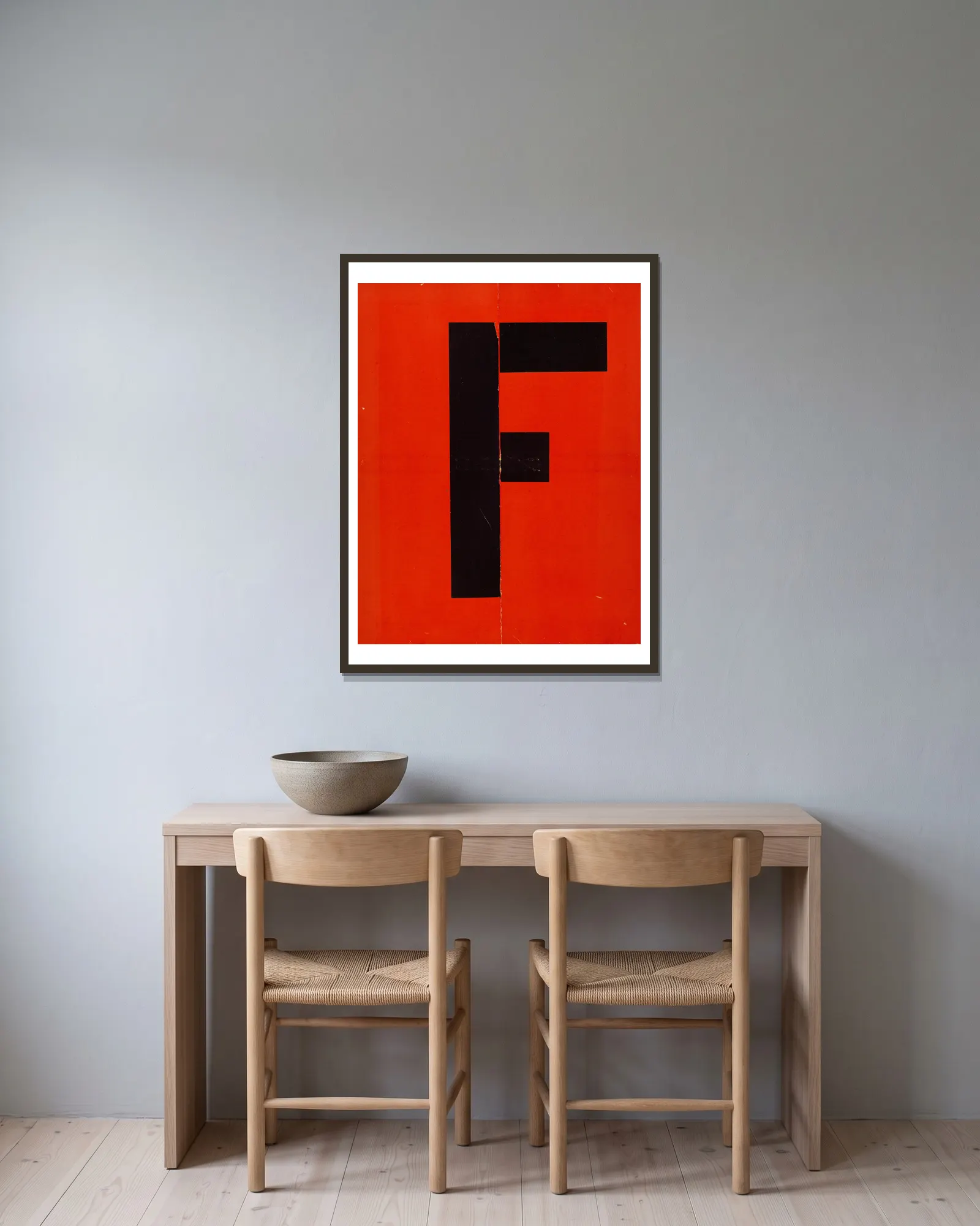 Figurines – cover av El Lissitzky inramad på en vägg