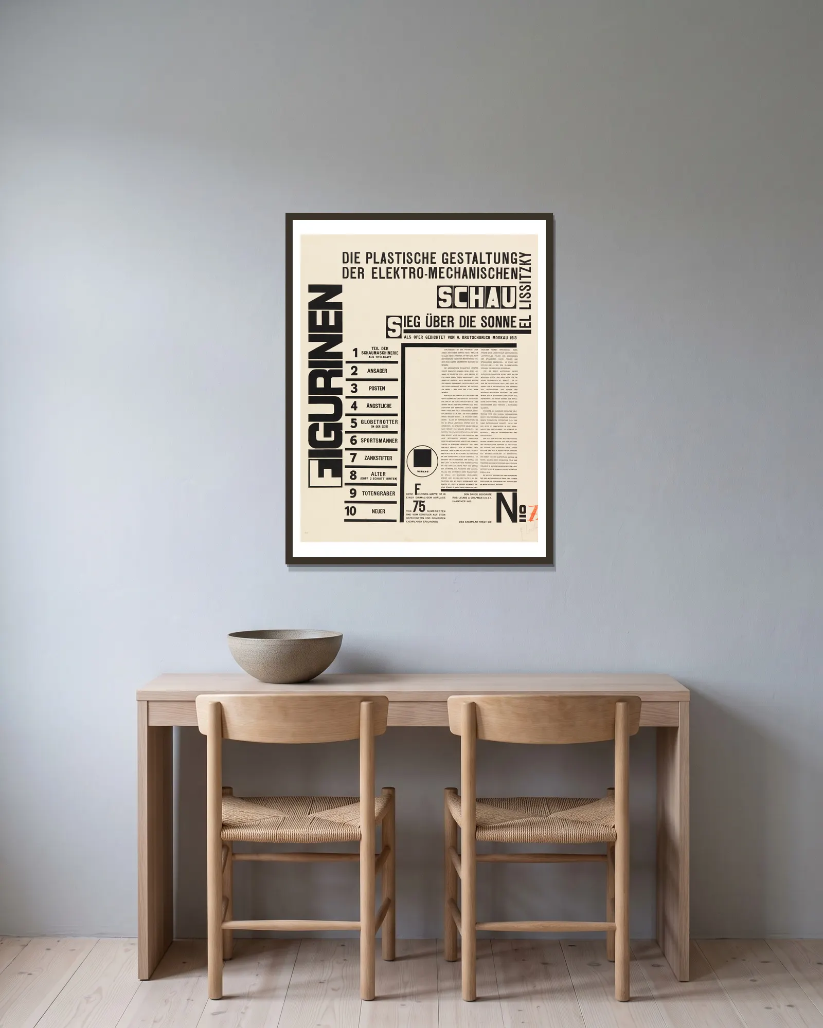Figurines – title page av El Lissitzky inramad på en vägg