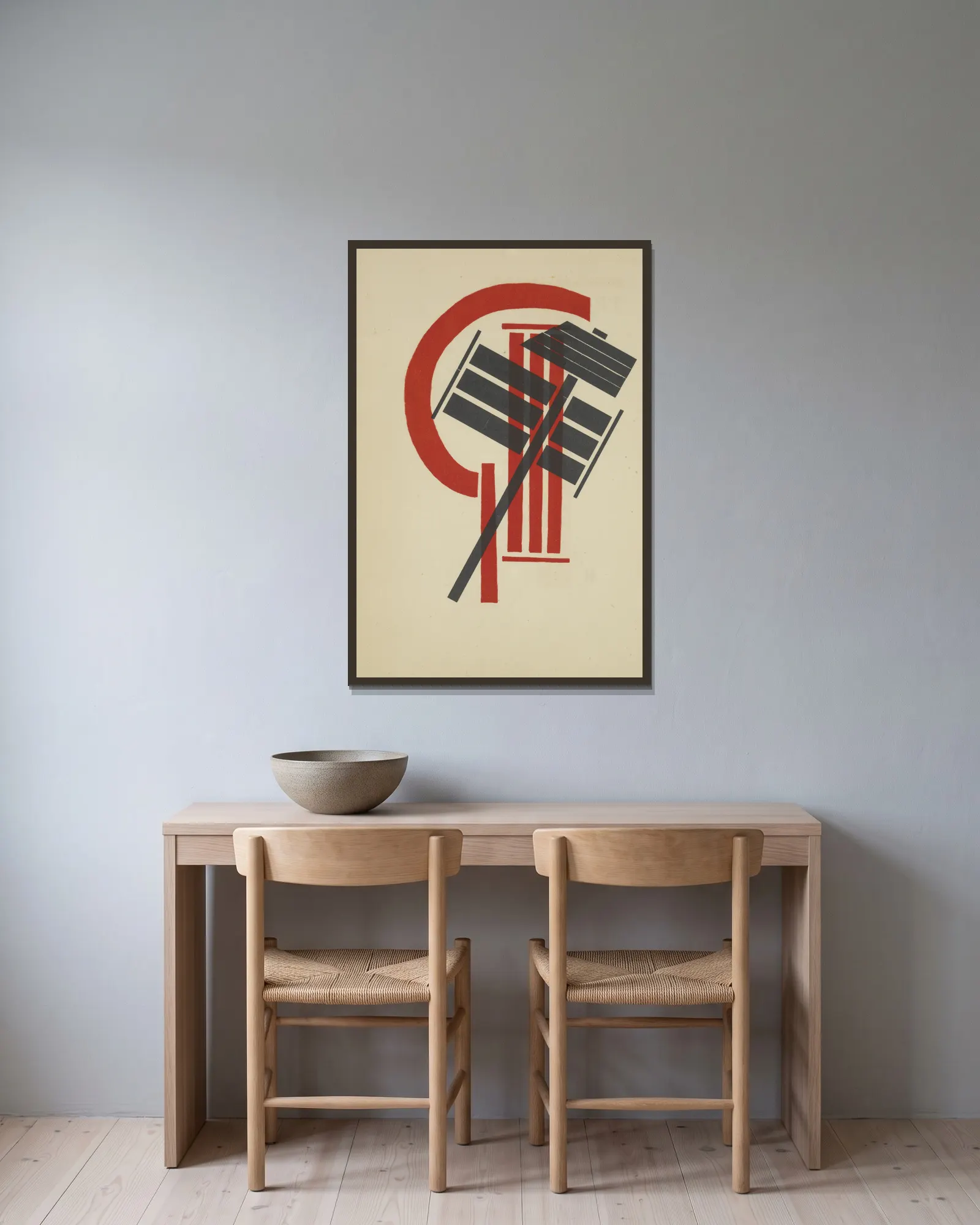 Internatsional av El Lissitzky inramad på en vägg
