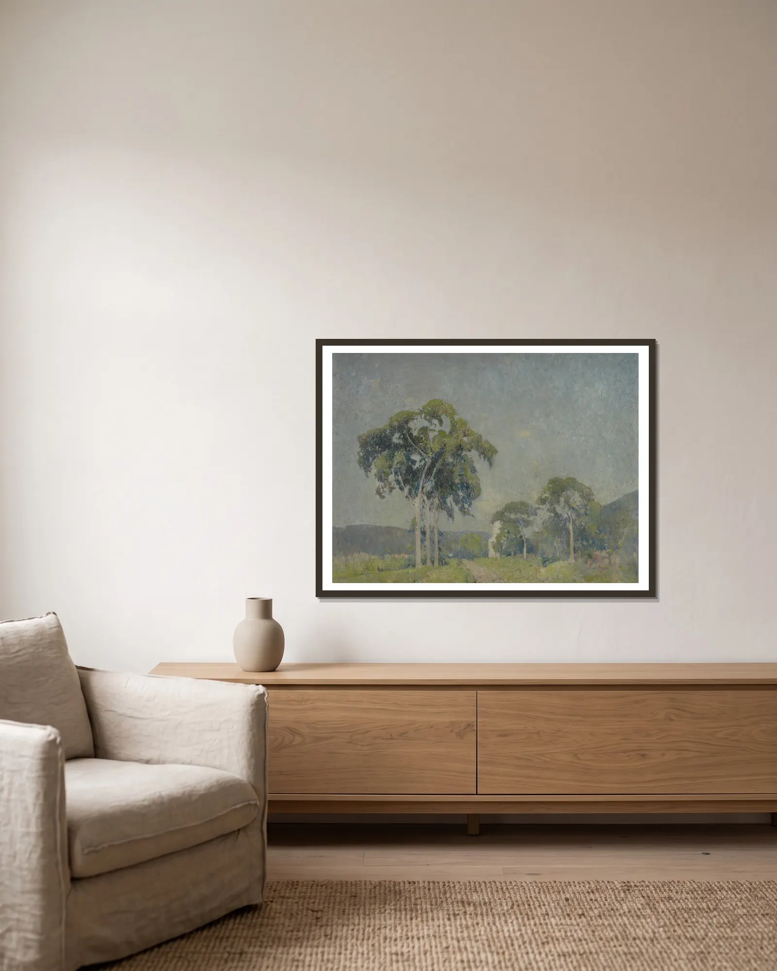 Landscape with Trees av Emil Carlsen inramad på en vägg