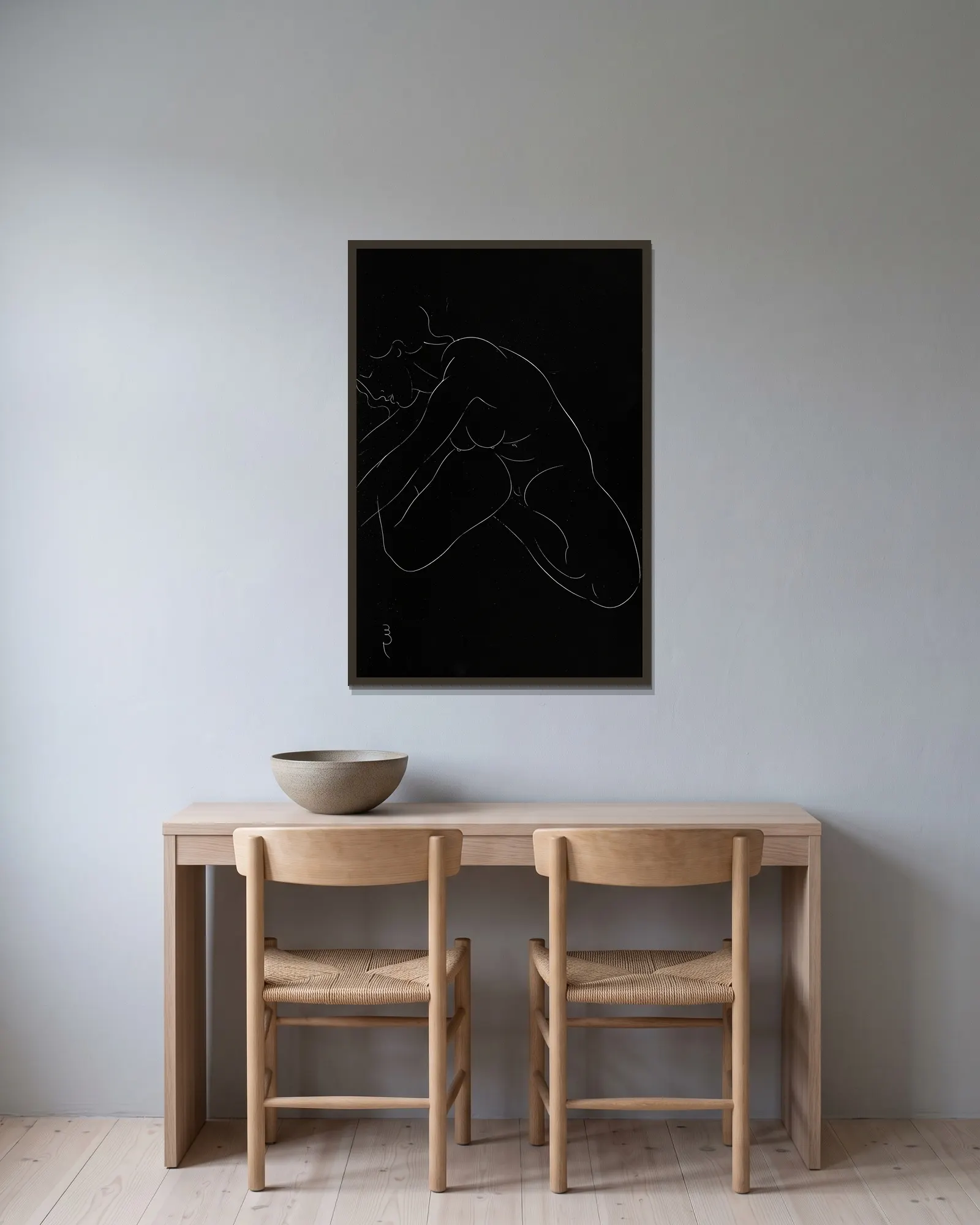 Twenty-five nudes Pl 11 av Eric Gill inramad på en vägg
