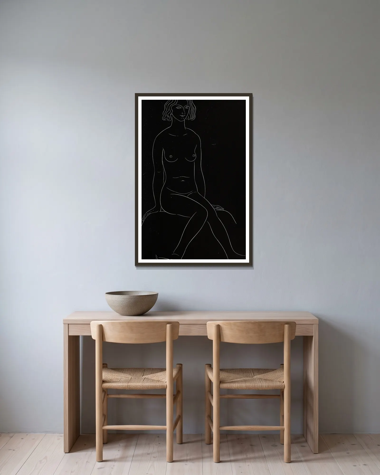 Twenty-five nudes Pl 19 av Eric Gill inramad på en vägg