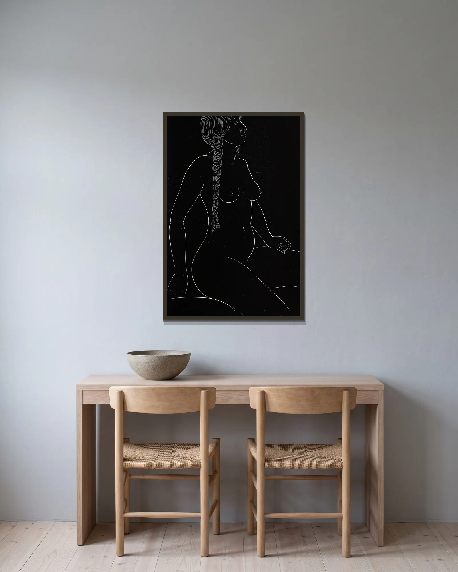 Twenty-five nudes Pl 24 av Eric Gill inramad på en vägg