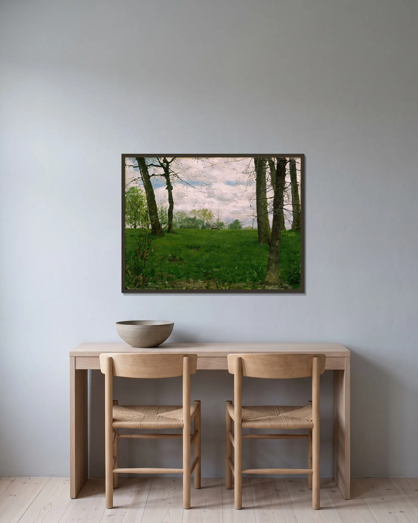 Green Fields av Erik Werenskiold inramad på en vägg