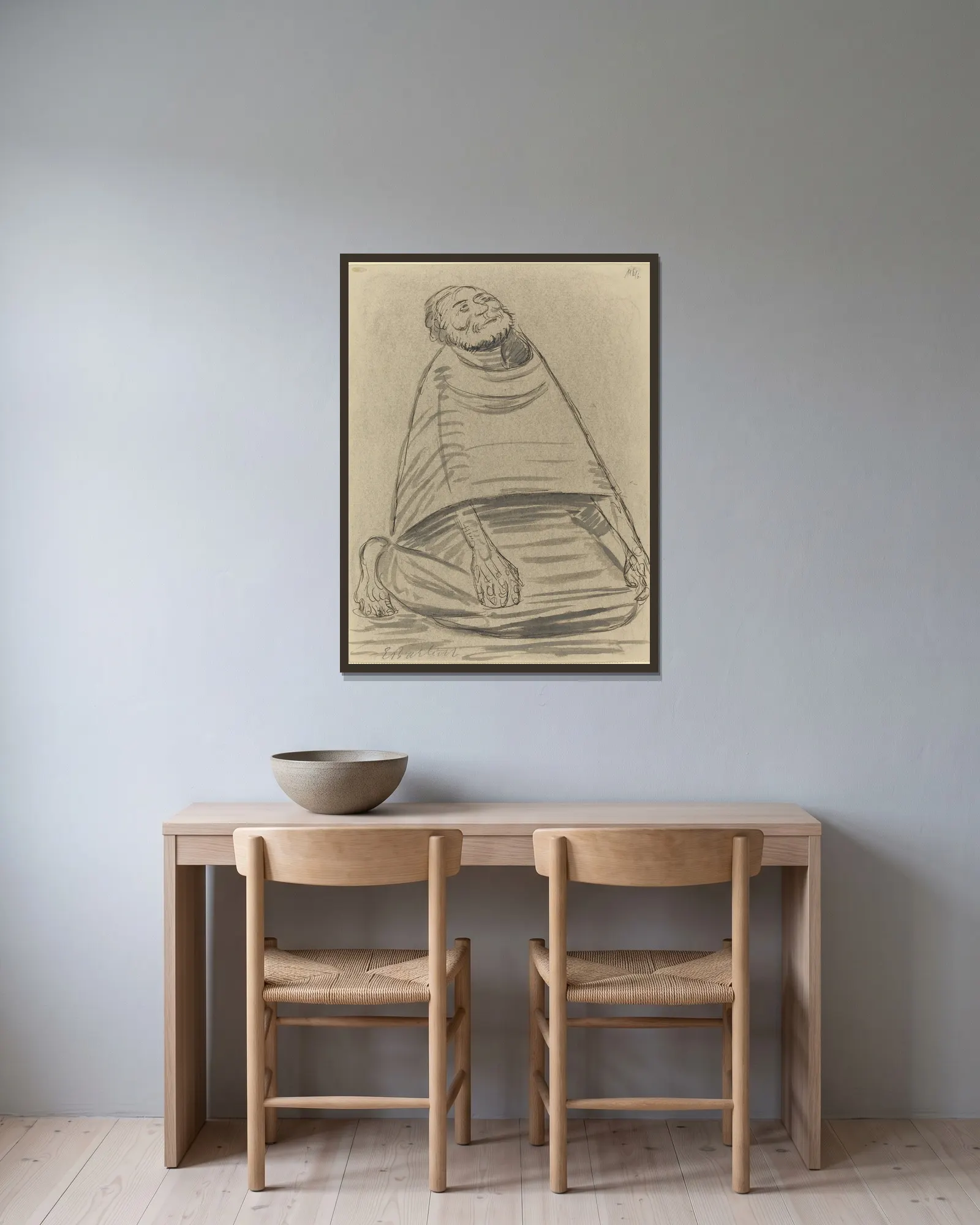 Man Kneeling av Ernst Barlach inramad på en vägg