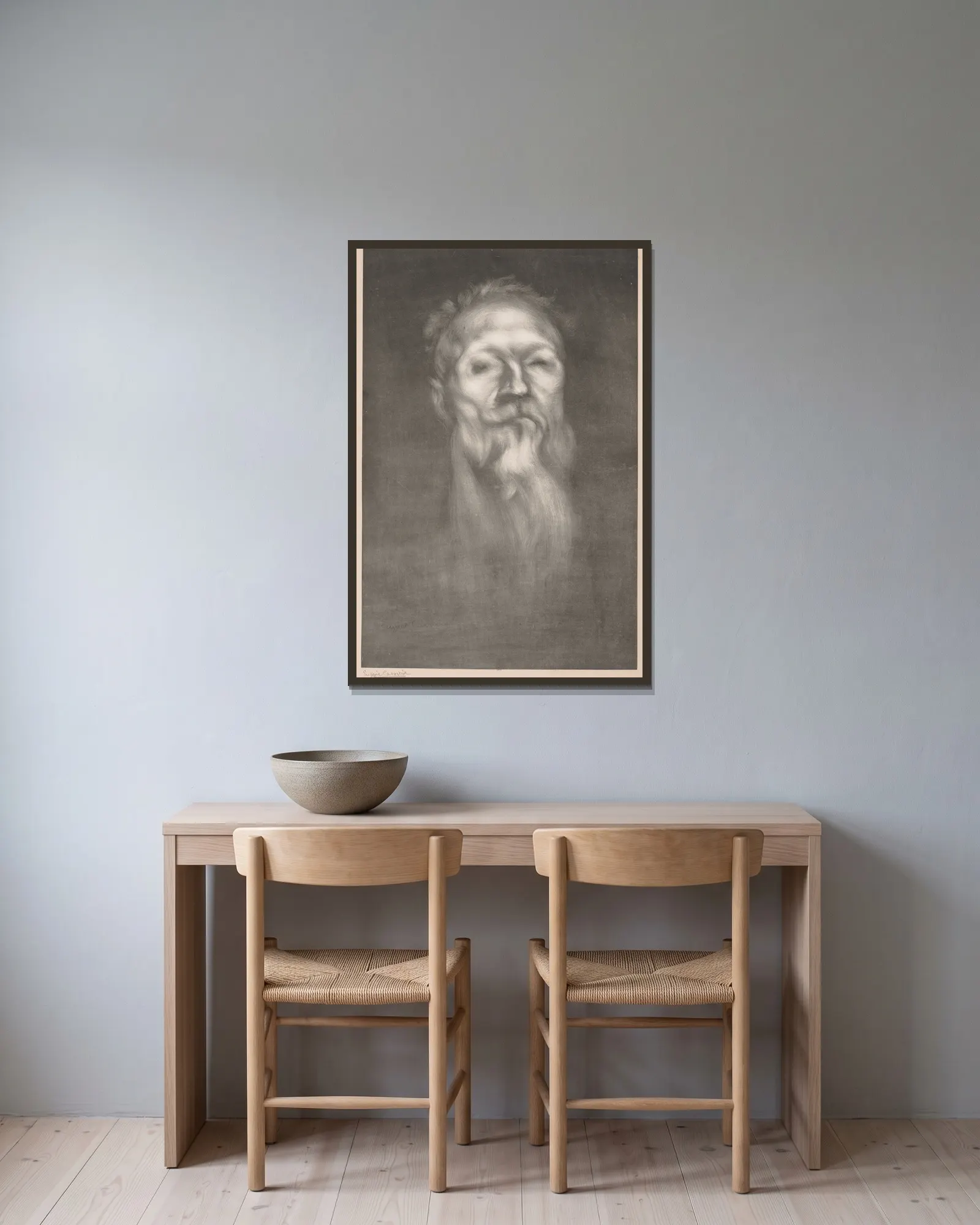 Auguste Rodin av Eugène Carriere inramad på en vägg