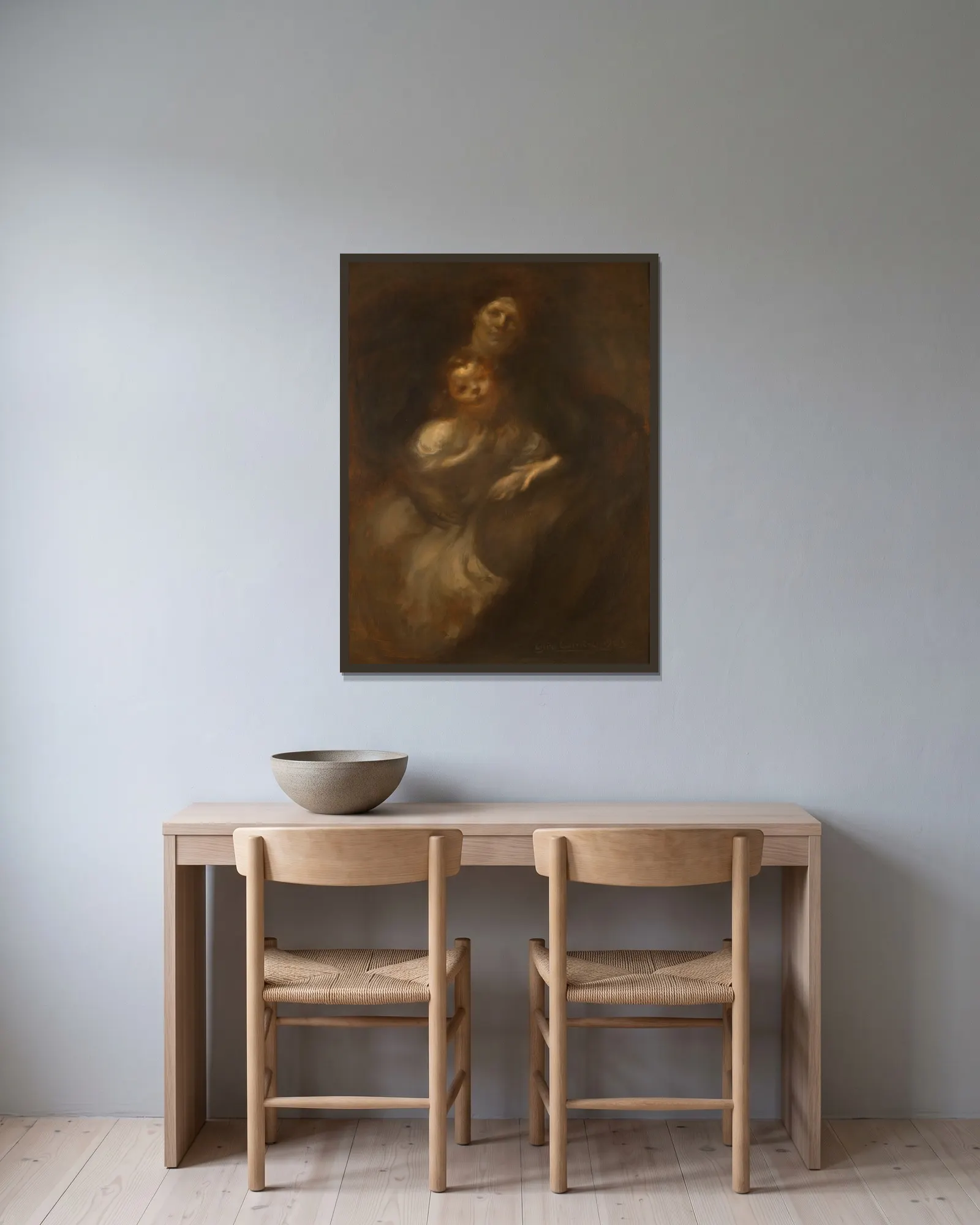 Maternité av Eugène Carriere inramad på en vägg