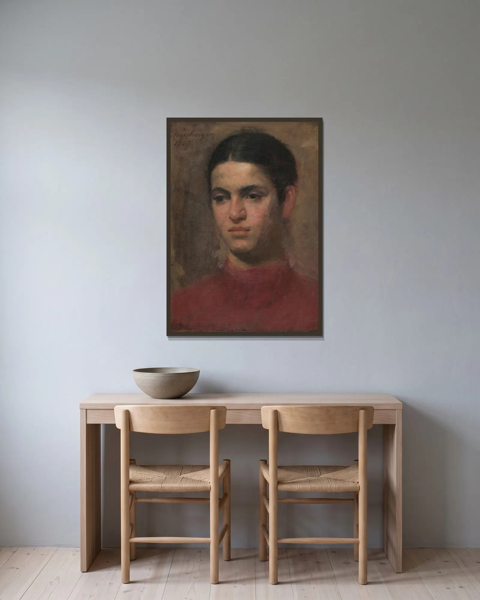 Girl’s head av Ferdinand Katona inramad på en vägg