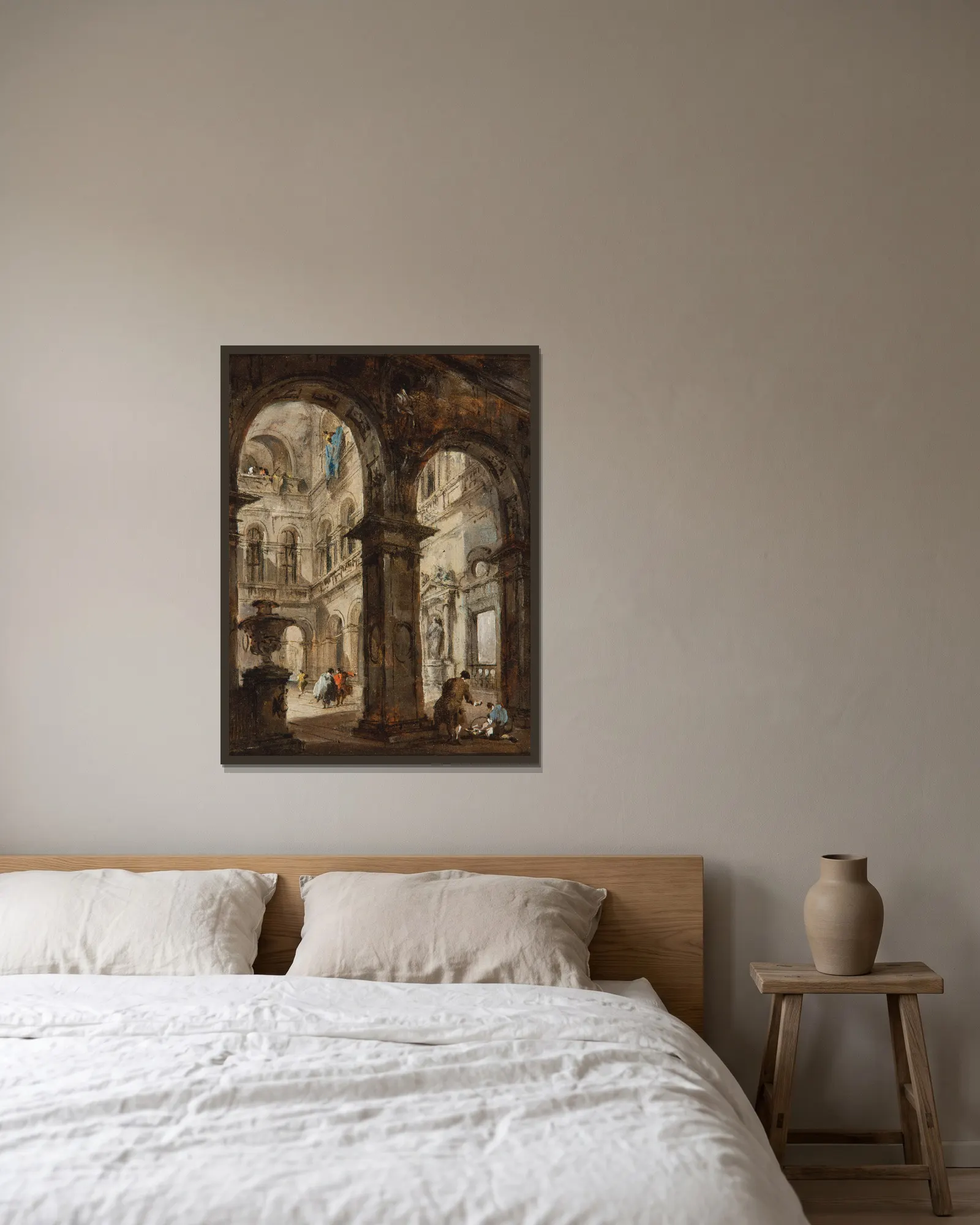 An architectural capriccio av Francesco Guardi inramad på en vägg