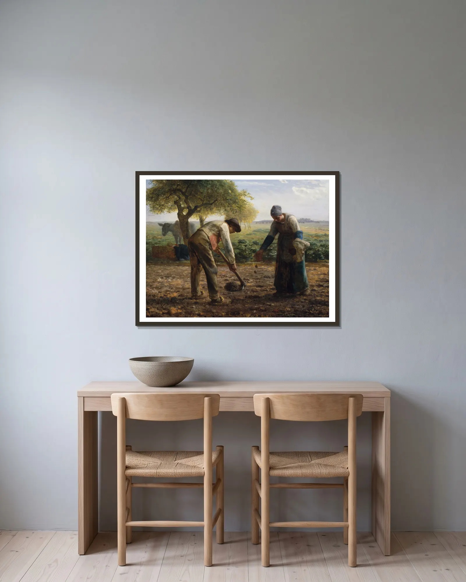 Potato Planters av Jean-François Millet inramad på en vägg
