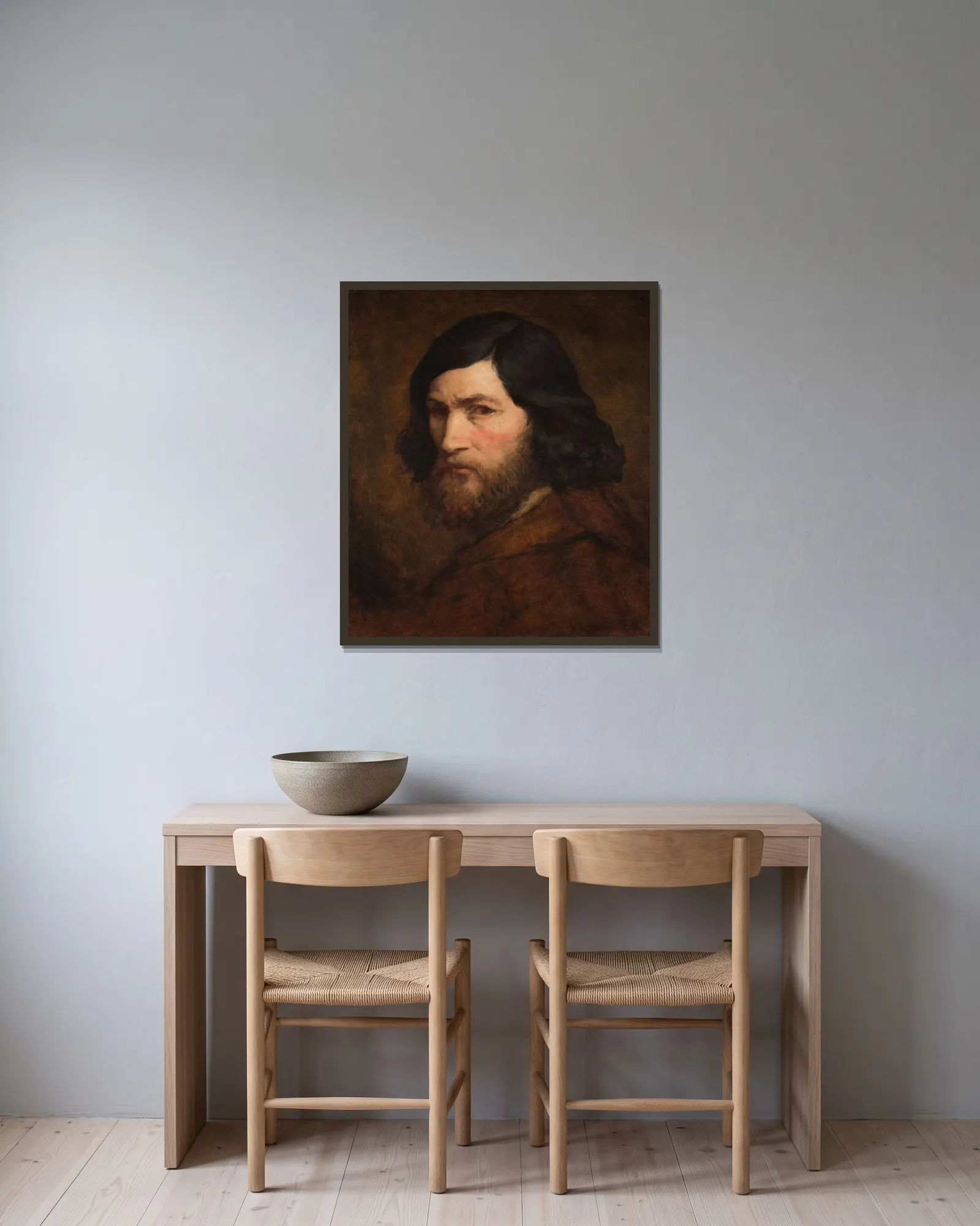 Selbstbildnis av Jean-François Millet inramad på en vägg