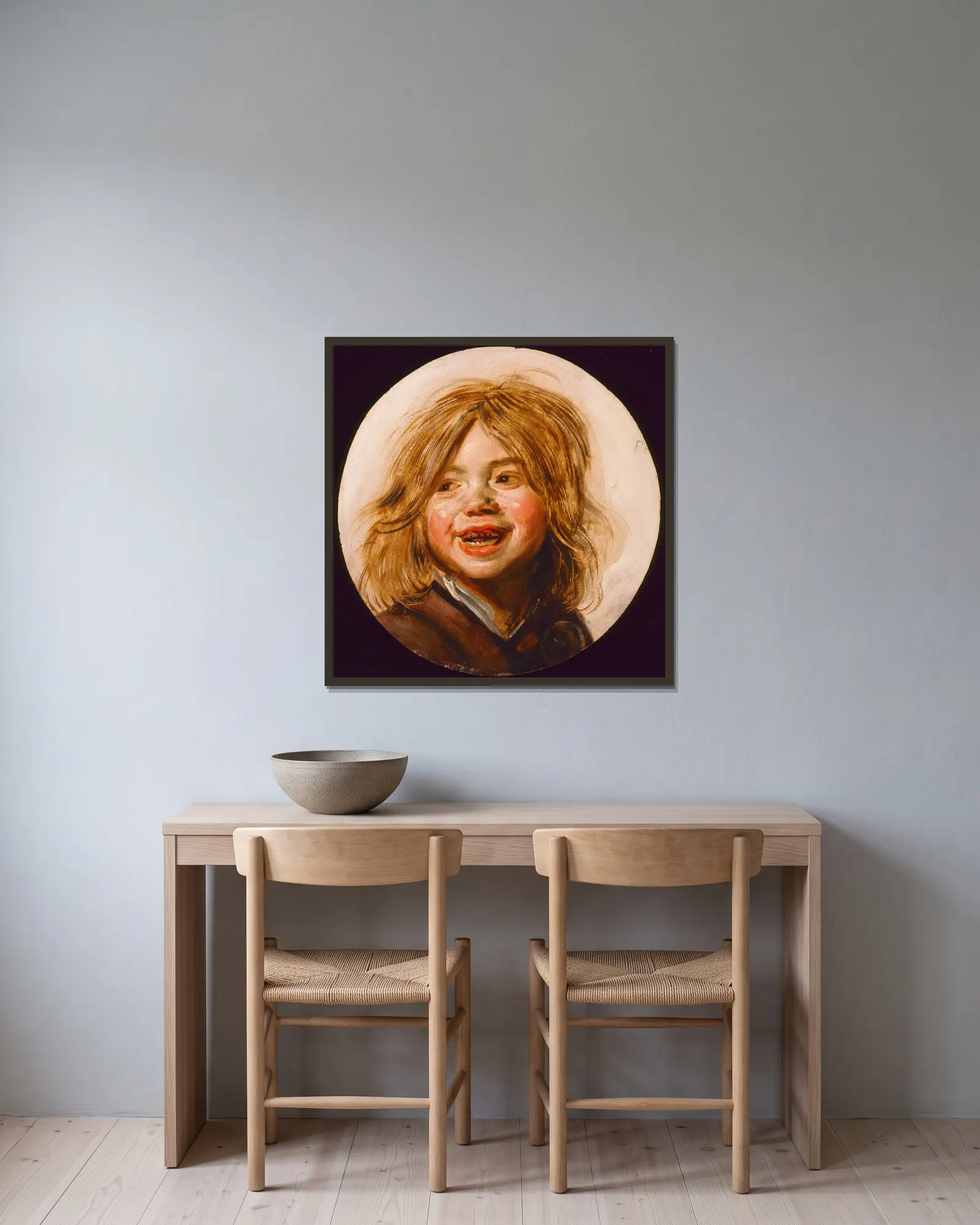 Laughing Child av Frans Hals inramad på en vägg