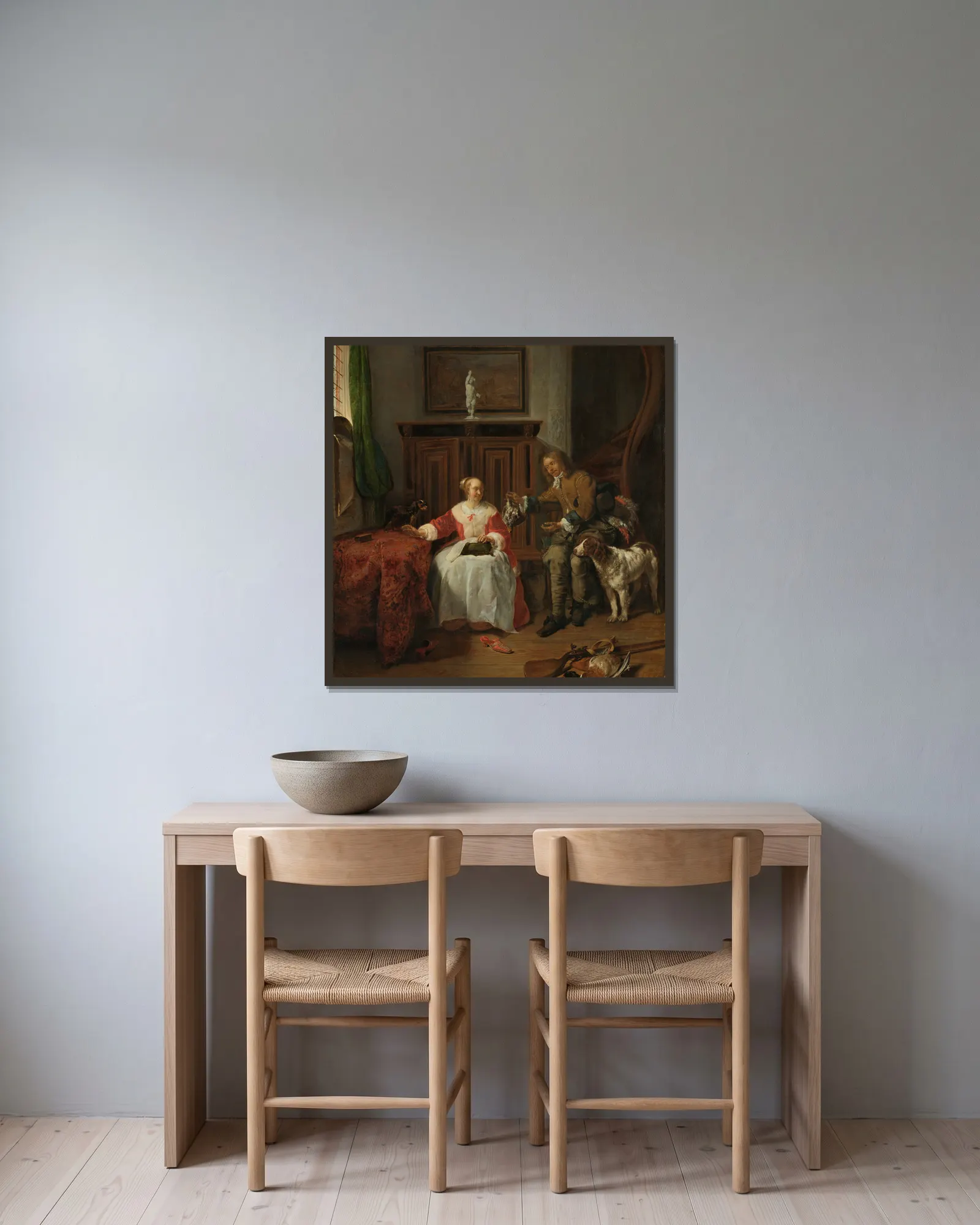 The Hunter’s Present av Gabriel Metsu inramad på en vägg