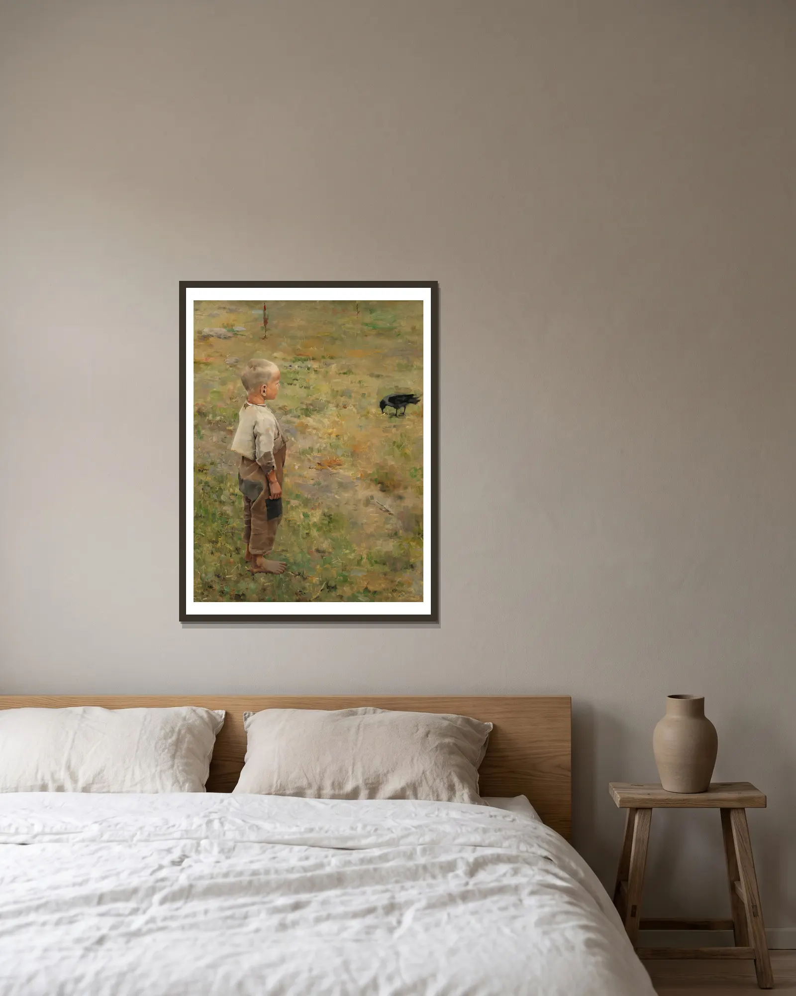 Boy With A Crow av Akseli Gallen-Kallela inramad på en vägg