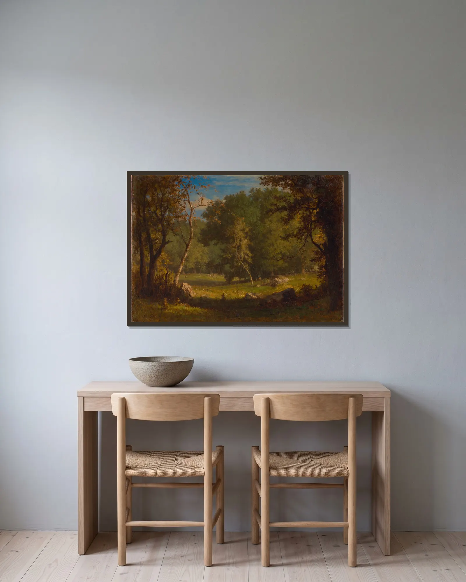 Elf Ground av George Inness inramad på en vägg