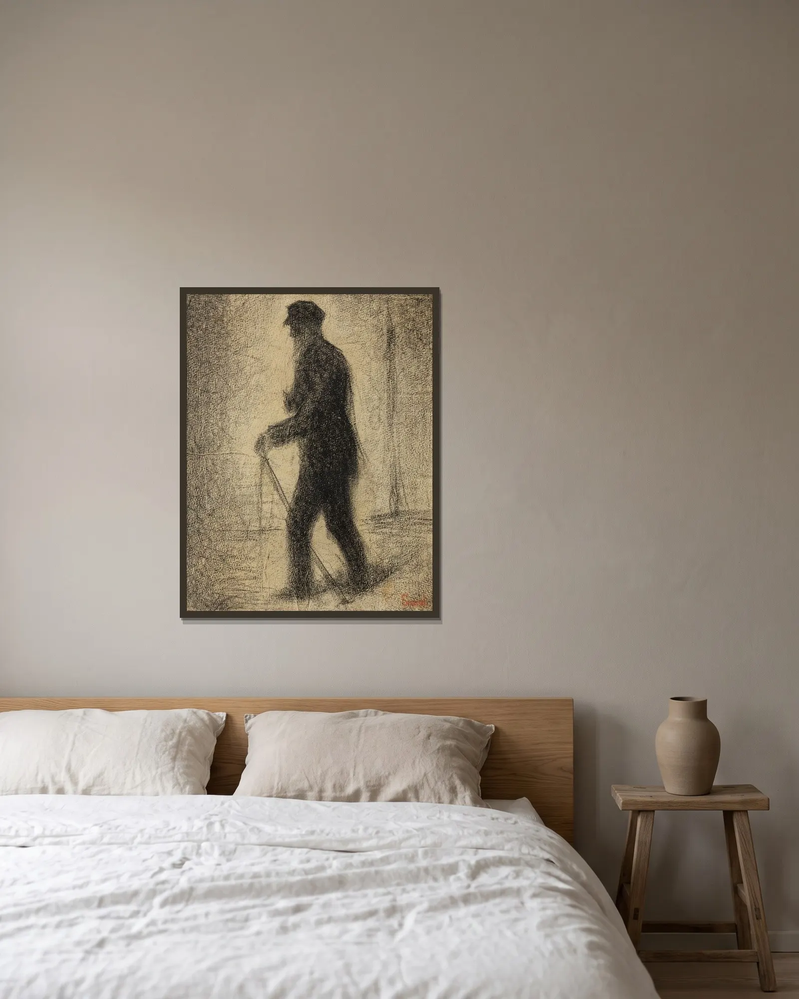 En marche av Georges Seurat inramad på en vägg