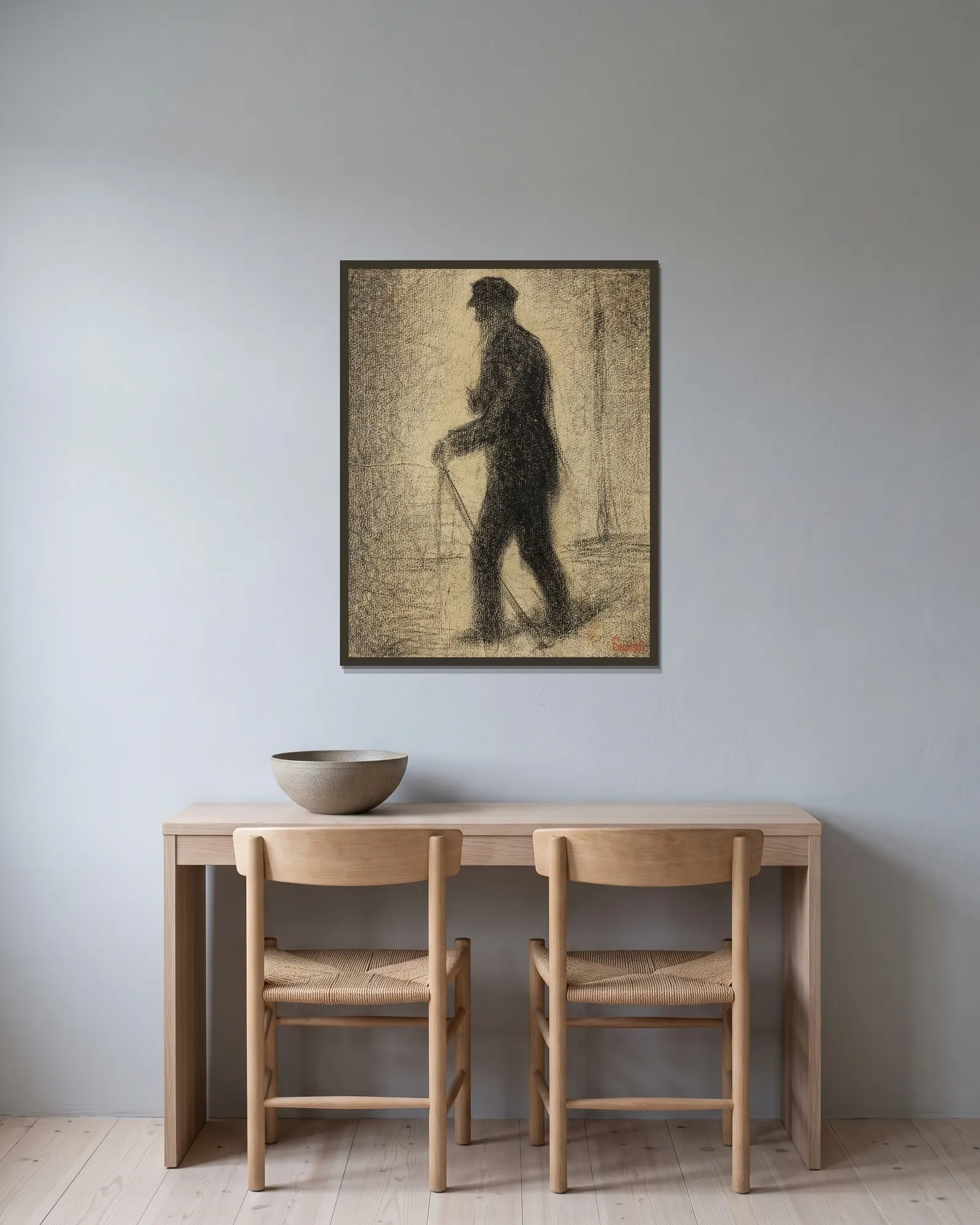 En marche av Georges Seurat inramad på en vägg