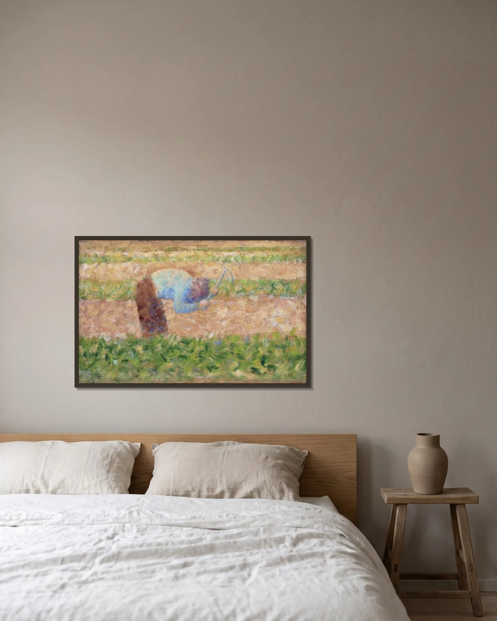 Man with a Hoe av Georges Seurat inramad på en vägg