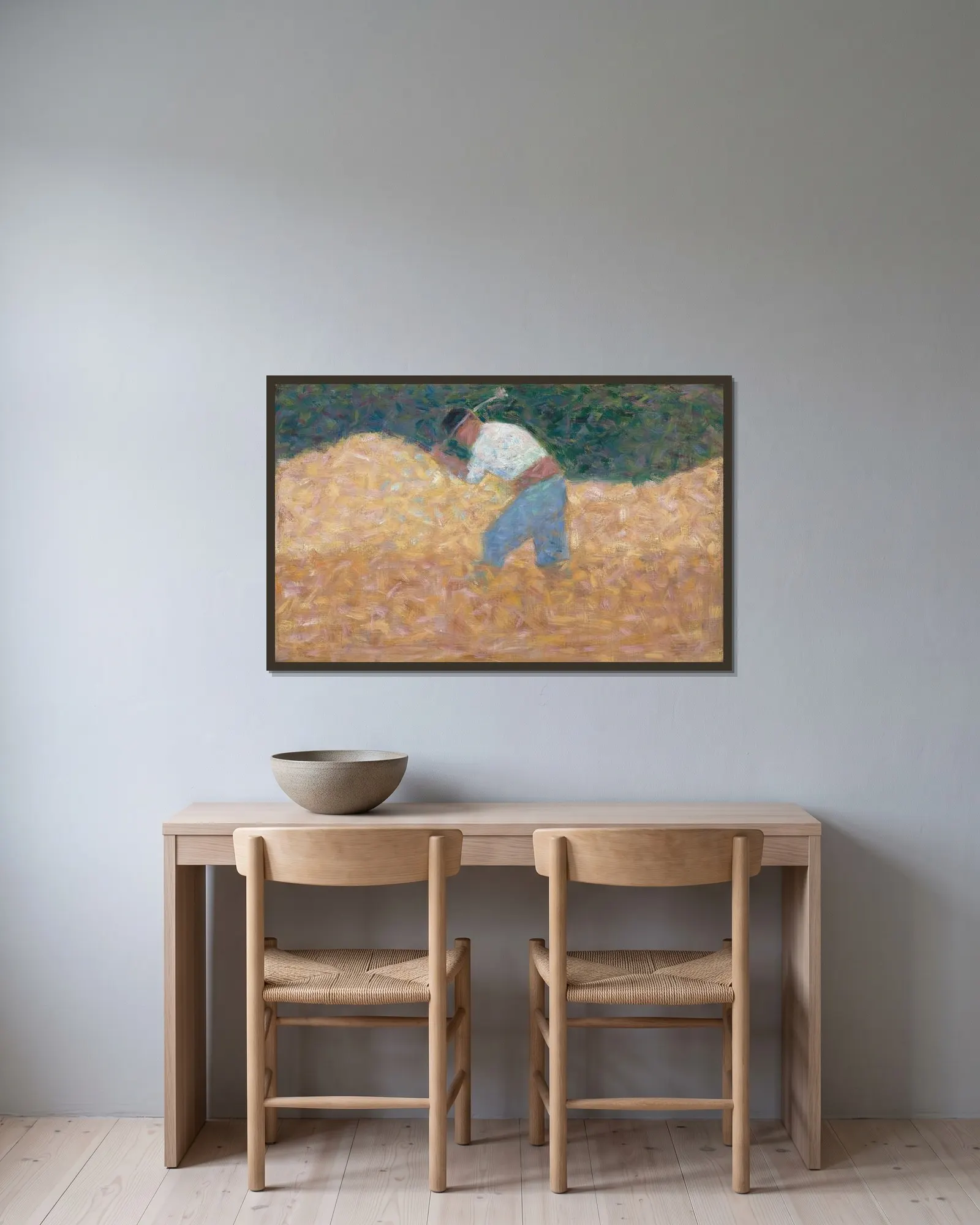 The Stone Breaker av Georges Seurat inramad på en vägg