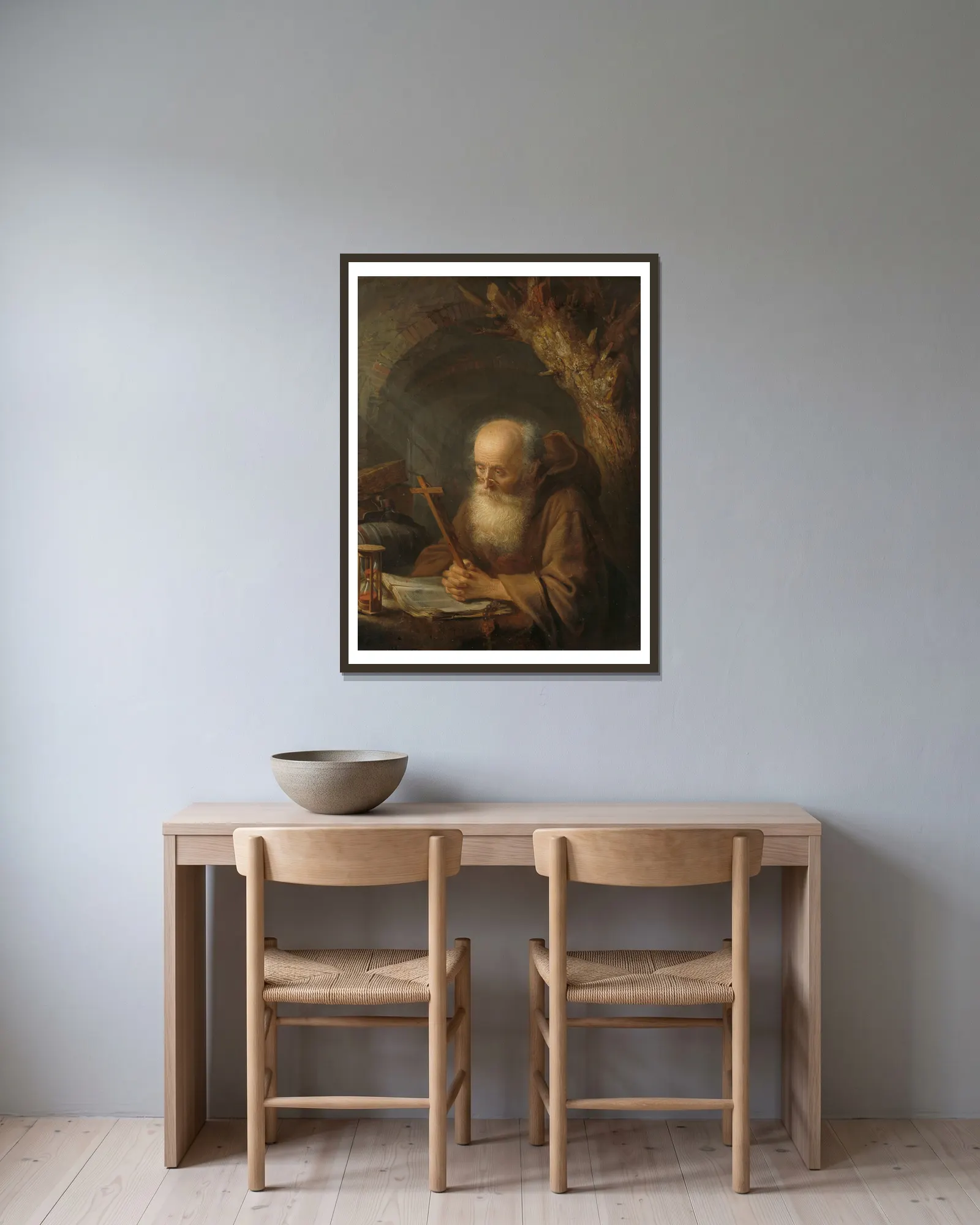 A Hermit av Gerrit Dou inramad på en vägg