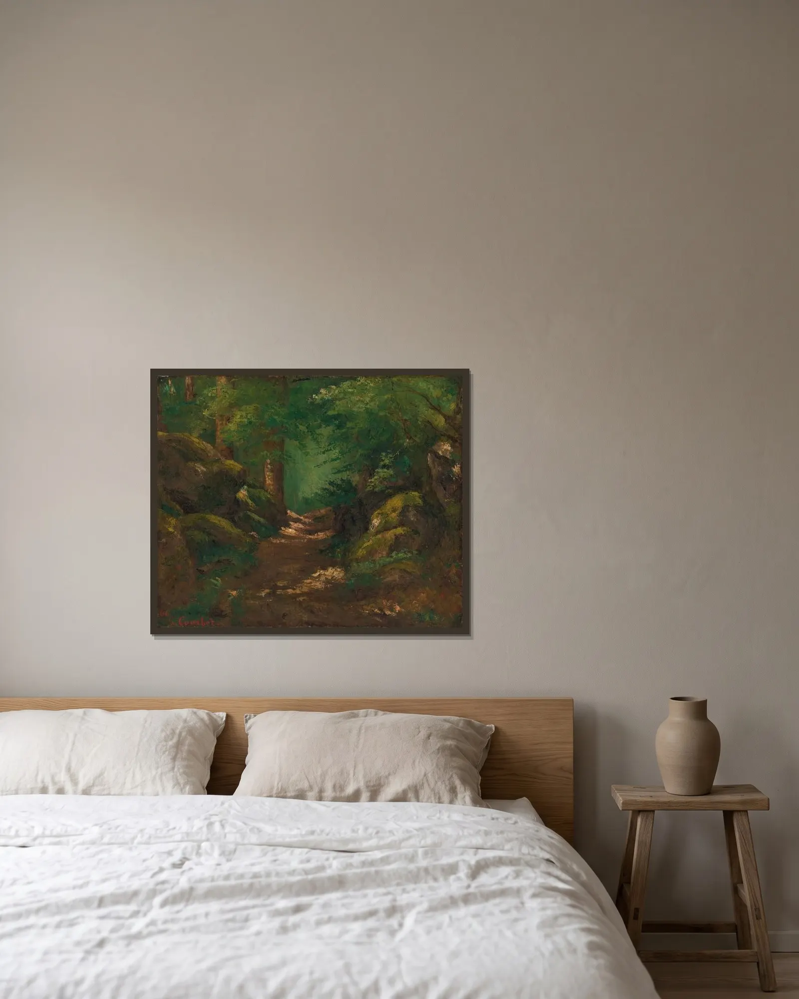 La Clairière av Gustave Courbet inramad på en vägg