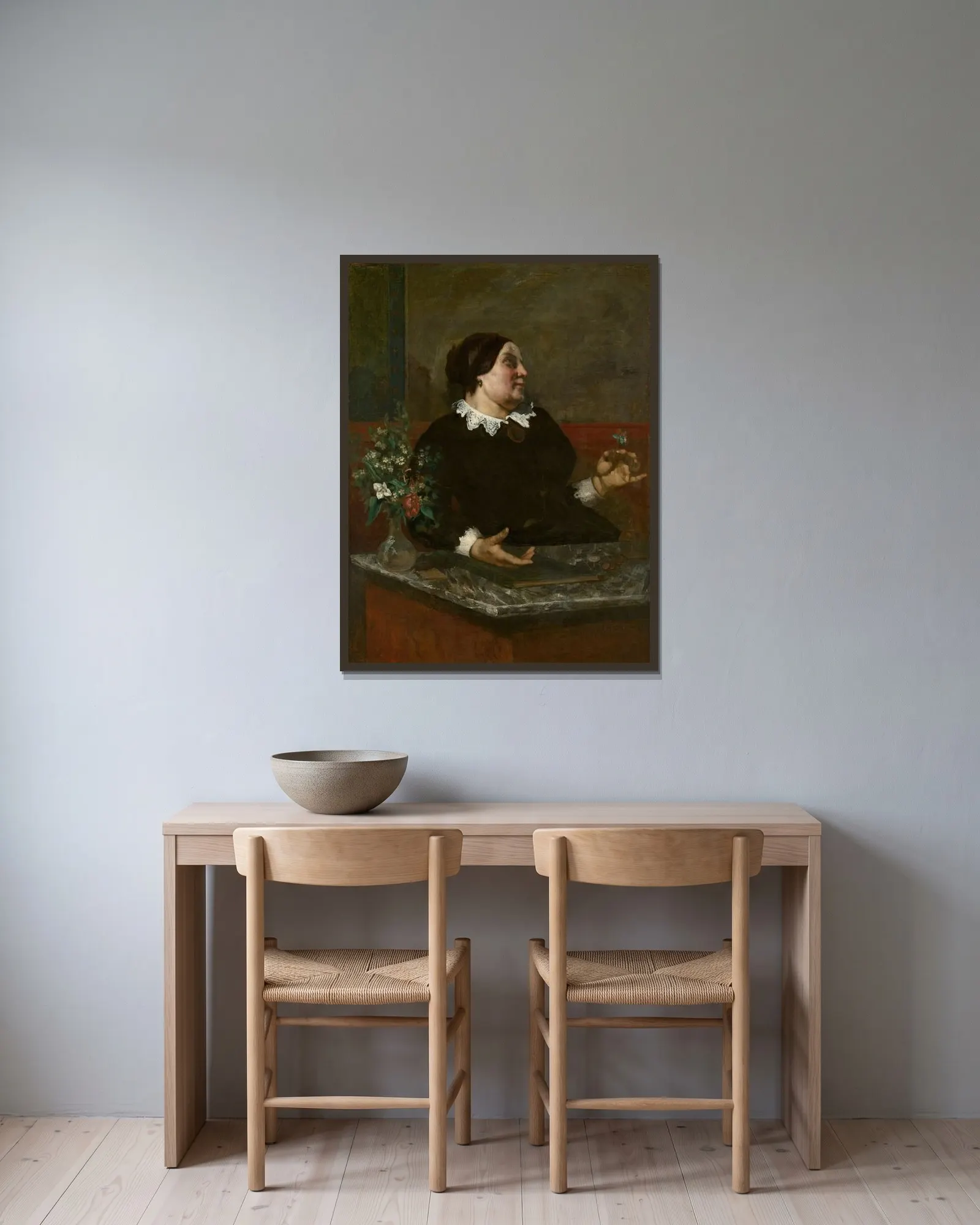 Mère Grégoire av Gustave Courbet inramad på en vägg
