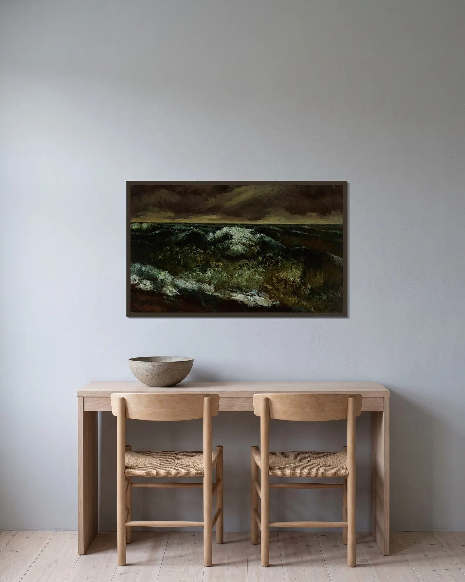 The Wave – nr 1 av Gustave Courbet inramad på en vägg