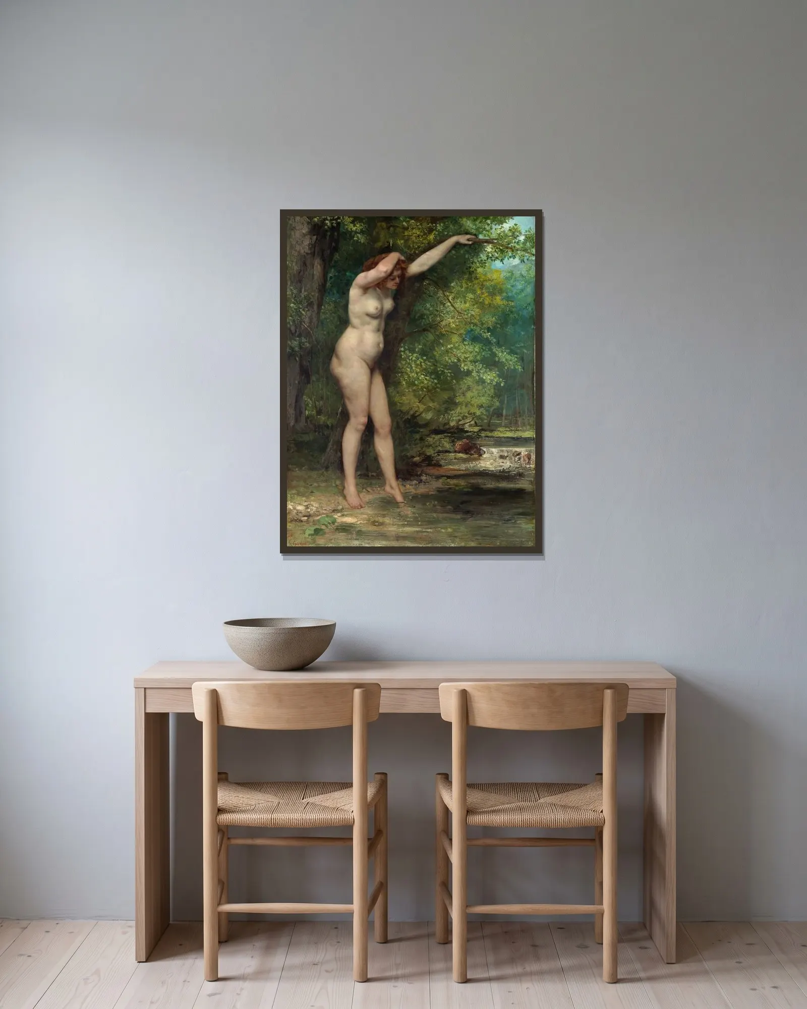 The Young Bather av Gustave Courbet inramad på en vägg