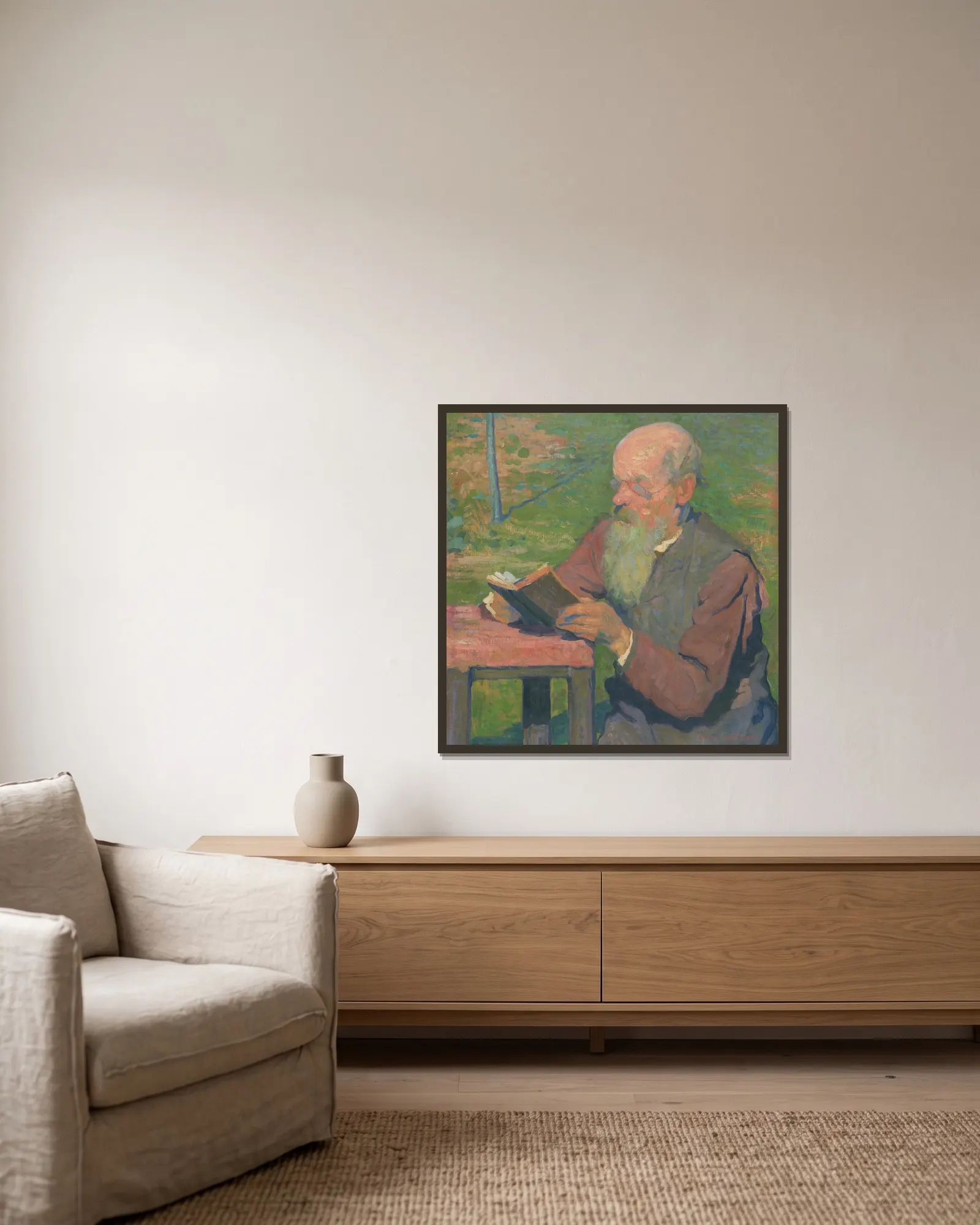 A reading old man av Elemír Halász-Hradil inramad på en vägg