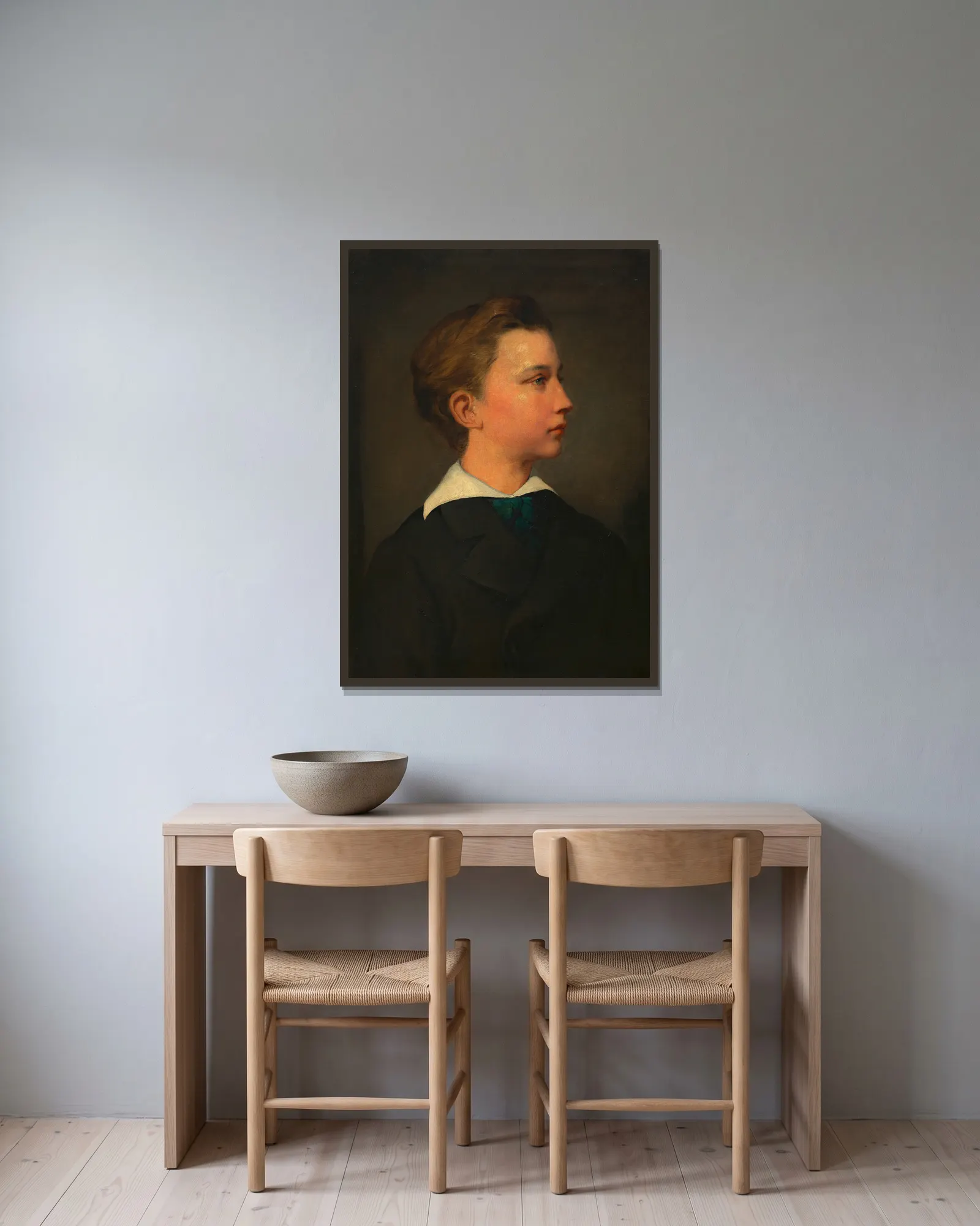 Porträt eines Knaben av Hans Canon inramad på en vägg
