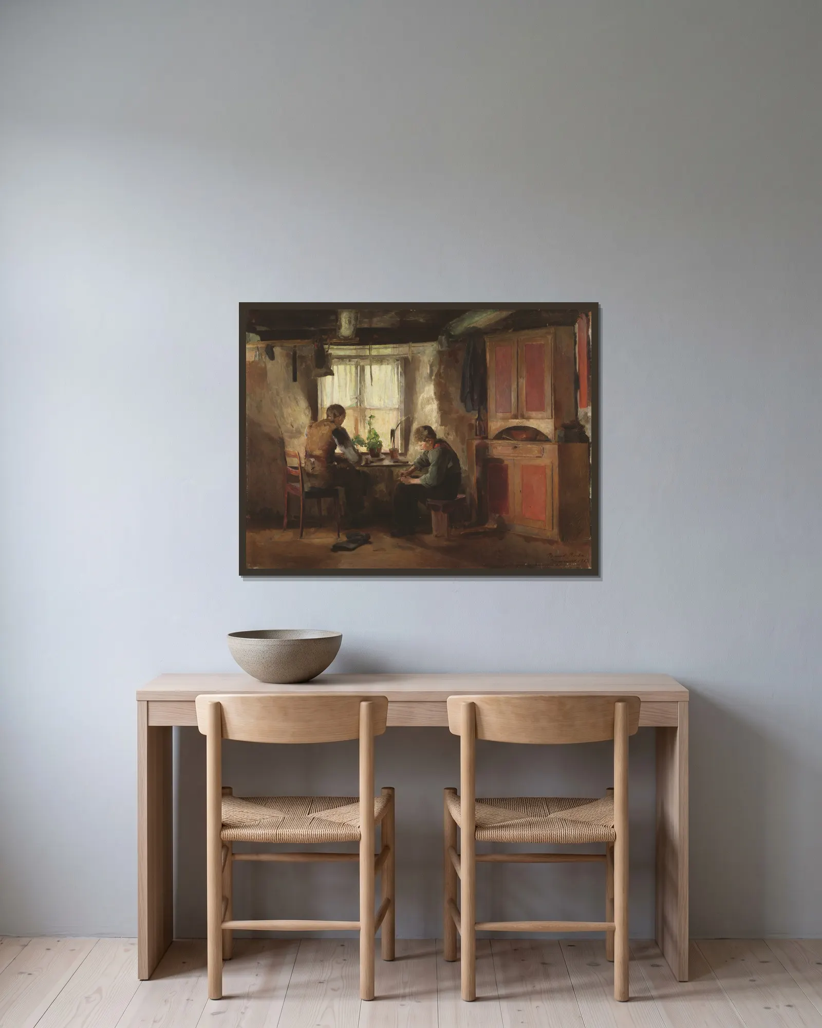 A Country Cobbler av Harriet Backer inramad på en vägg