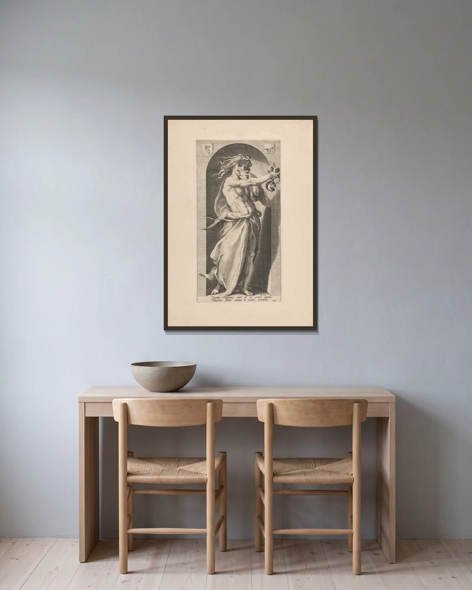 Envy av Hendrick Goltzius inramad på en vägg