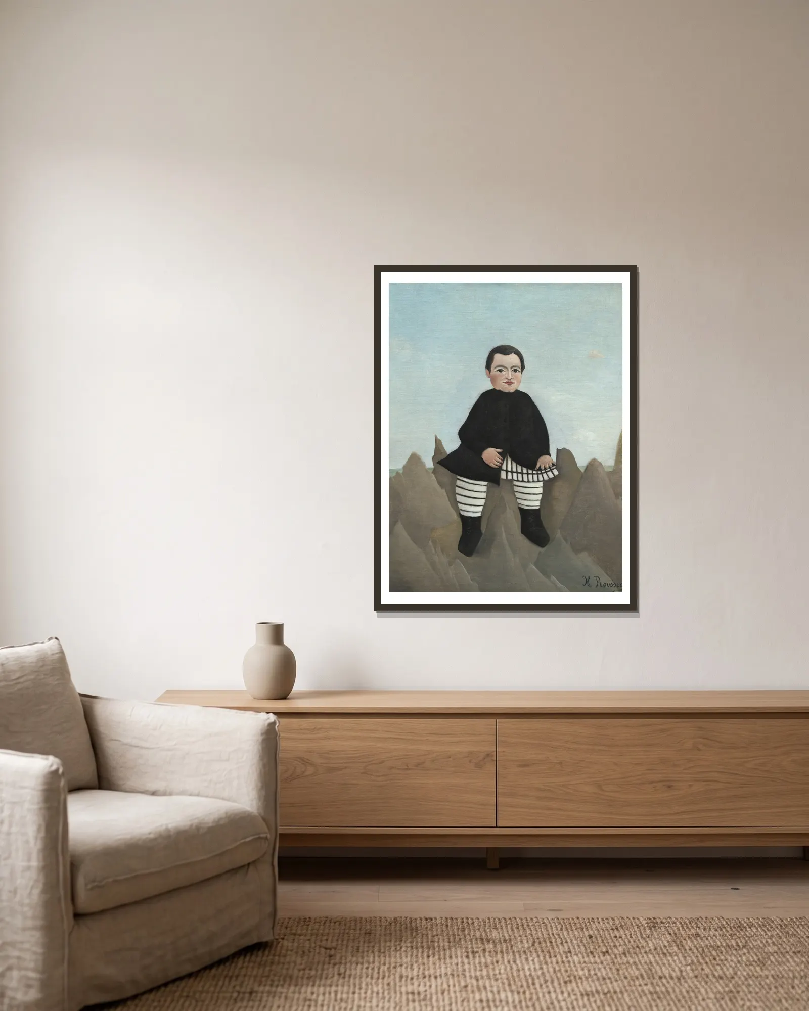 Boy on the Rocks av Henri Rousseau inramad på en vägg