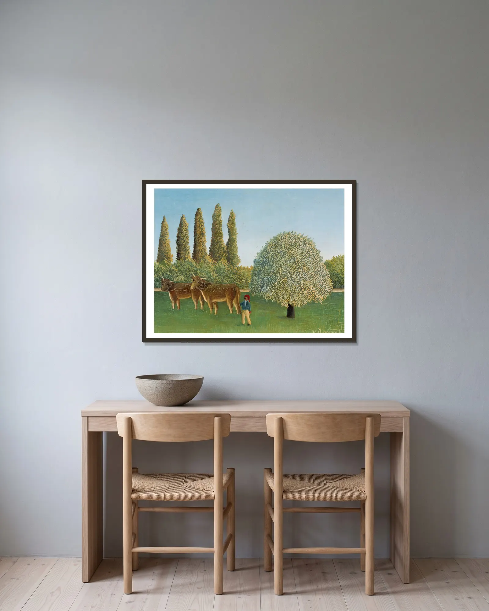 Meadowland (The Pasture) av Henri Rousseau inramad på en vägg